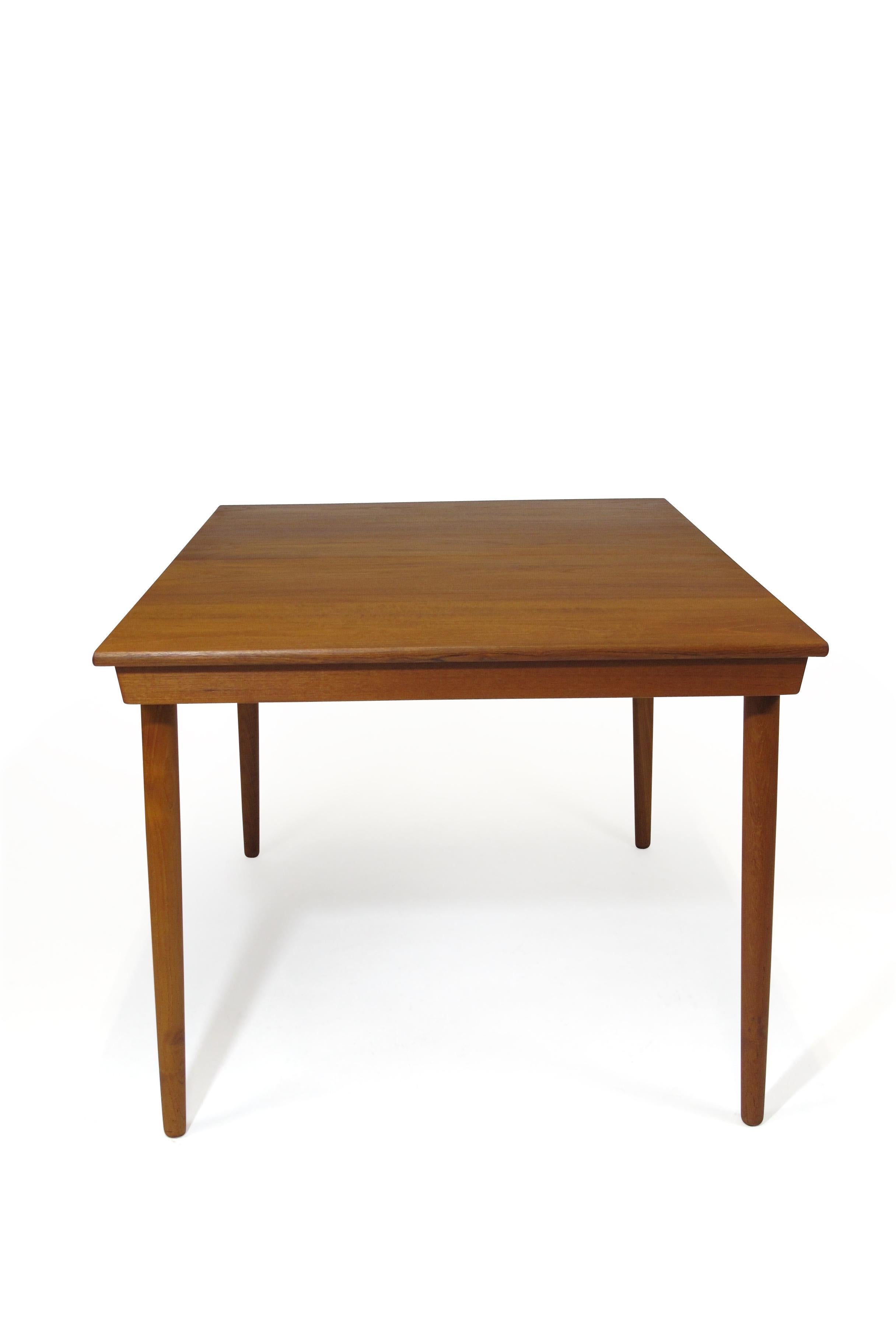 Midcentury teak dining table designed by Hans Olsen for Frem Rojle model 720/21, circa 1961, Denmark. Table seats 6 closed and up to 8 guests comfortably with butterfly leaf extended. Fully restored in excellent condition. Full extension with
