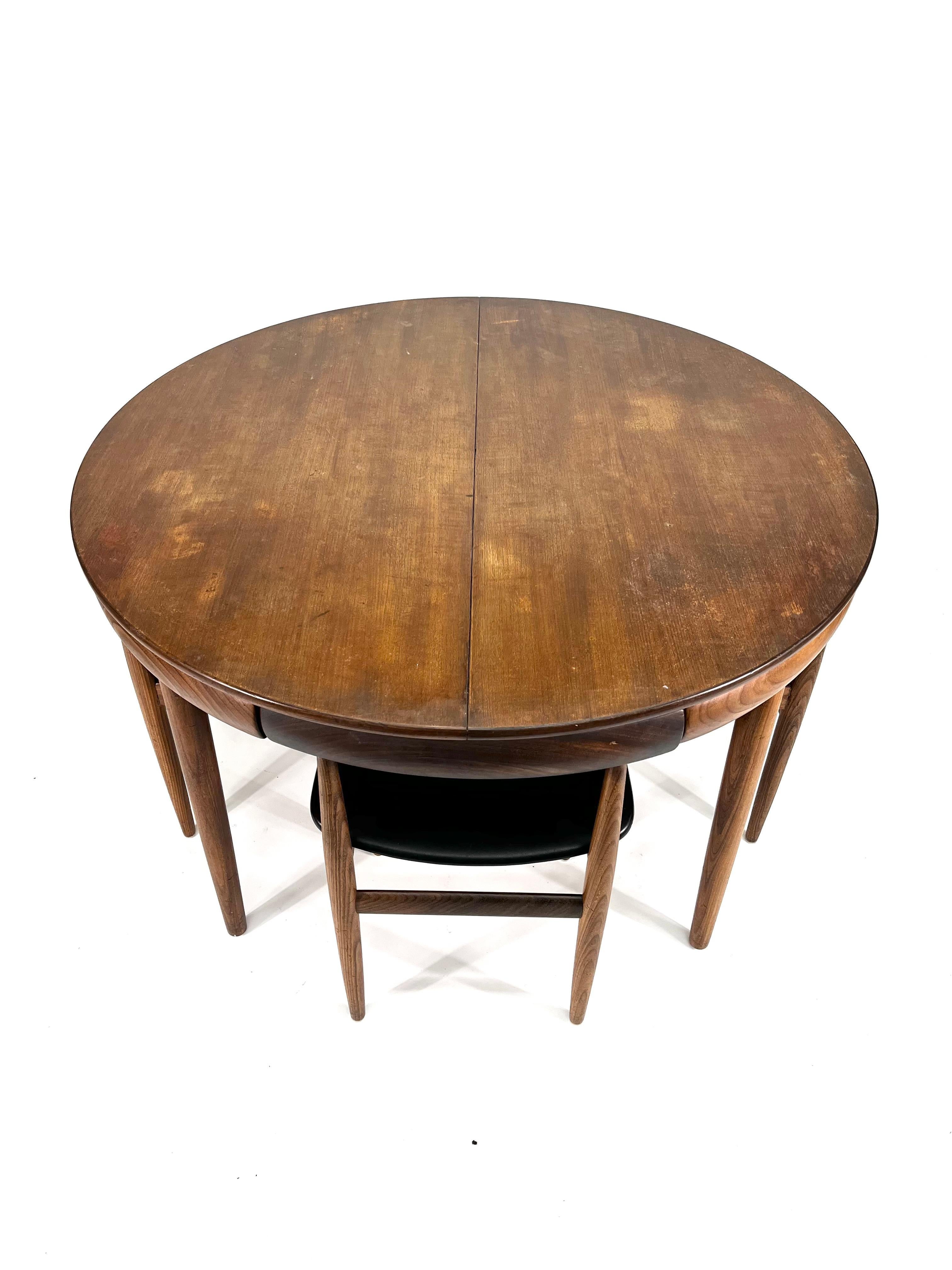 Has not yet been restored but will be back to excellent condition with new upholstery. 

Designed by Hans Olsen, this 1960s dining table and chairs set is a fantastic example of mid century Danish design. Comprising of a ‘roundette’ table and 4