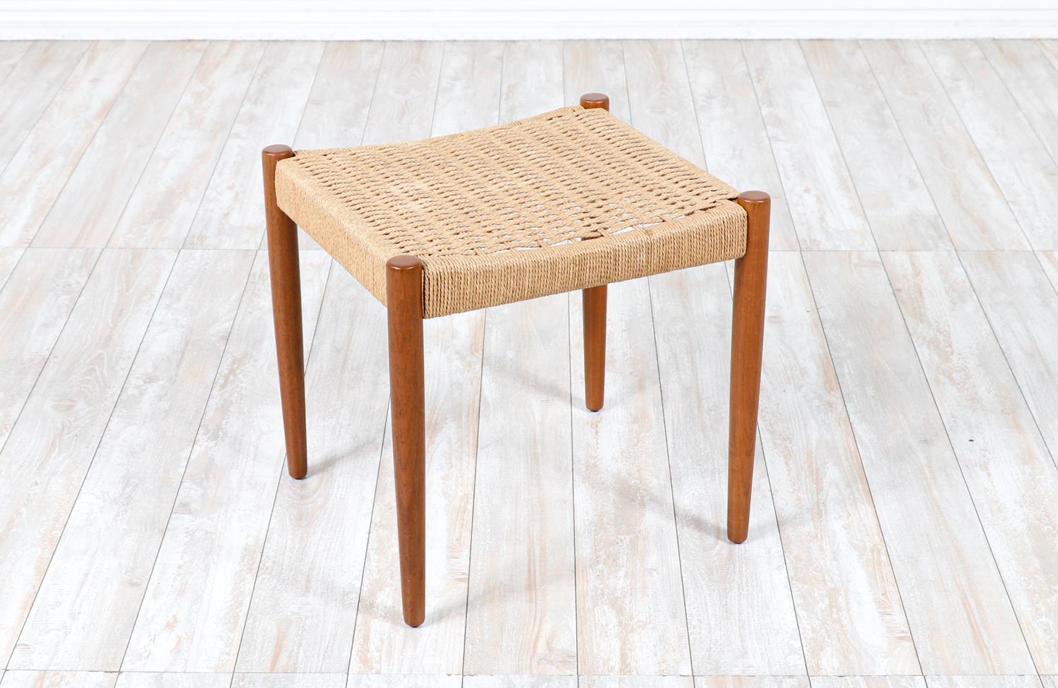 Hans Olsen teak & rush chord stool for Frem Rojle.

________________________________________

Transforming a piece of Mid-Century Modern furniture is like bringing history back to life, and we take this journey with passion and precision. With over