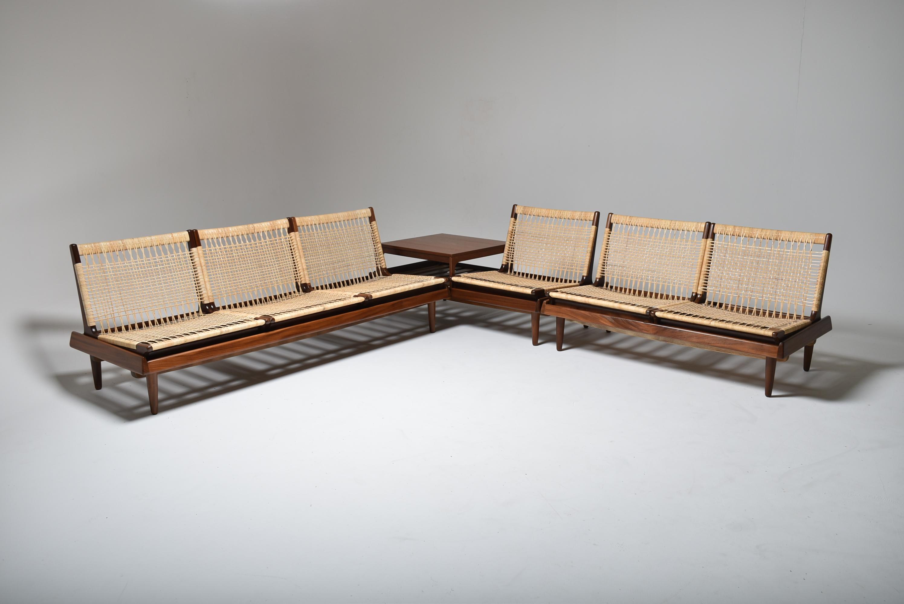 
Modular set by Hans HOLSEN for Bramin, teak structures. 
New canework in rattan, comprising a 3-seater bench, two 2-seater benches, 6 seaters and a coffee table. 
One cushion per seat, completely restored fabric and upholstery.  