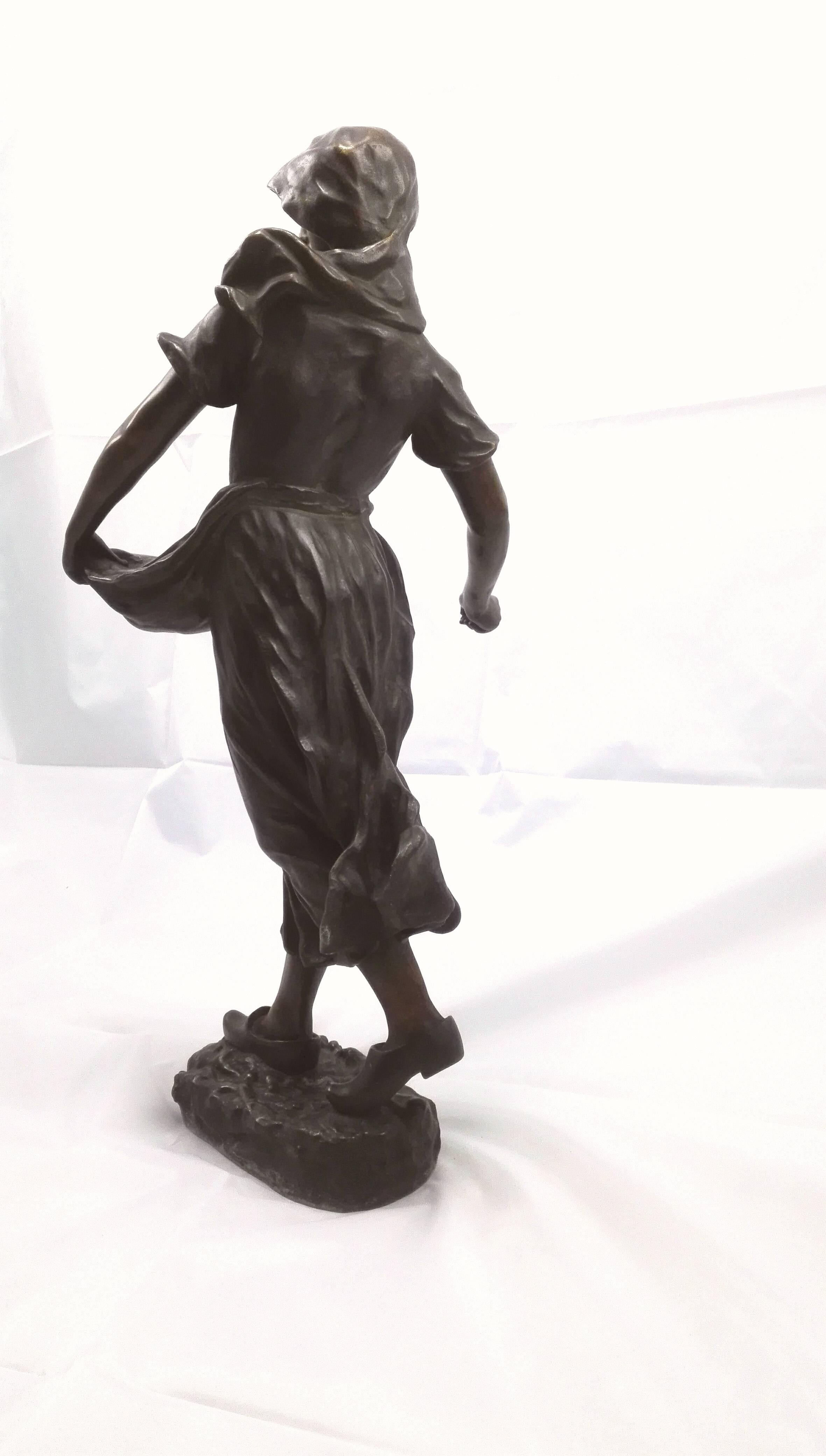 Born in Vienna/Austria, 1849. Bronze patinated. Dynamic depiction of a Dutch, young peasant woman in a vaden long dress and wooden slippers. Seeding the seed with the right hand, peppy and elegant! Holding the sapron with the seed in the left hand.