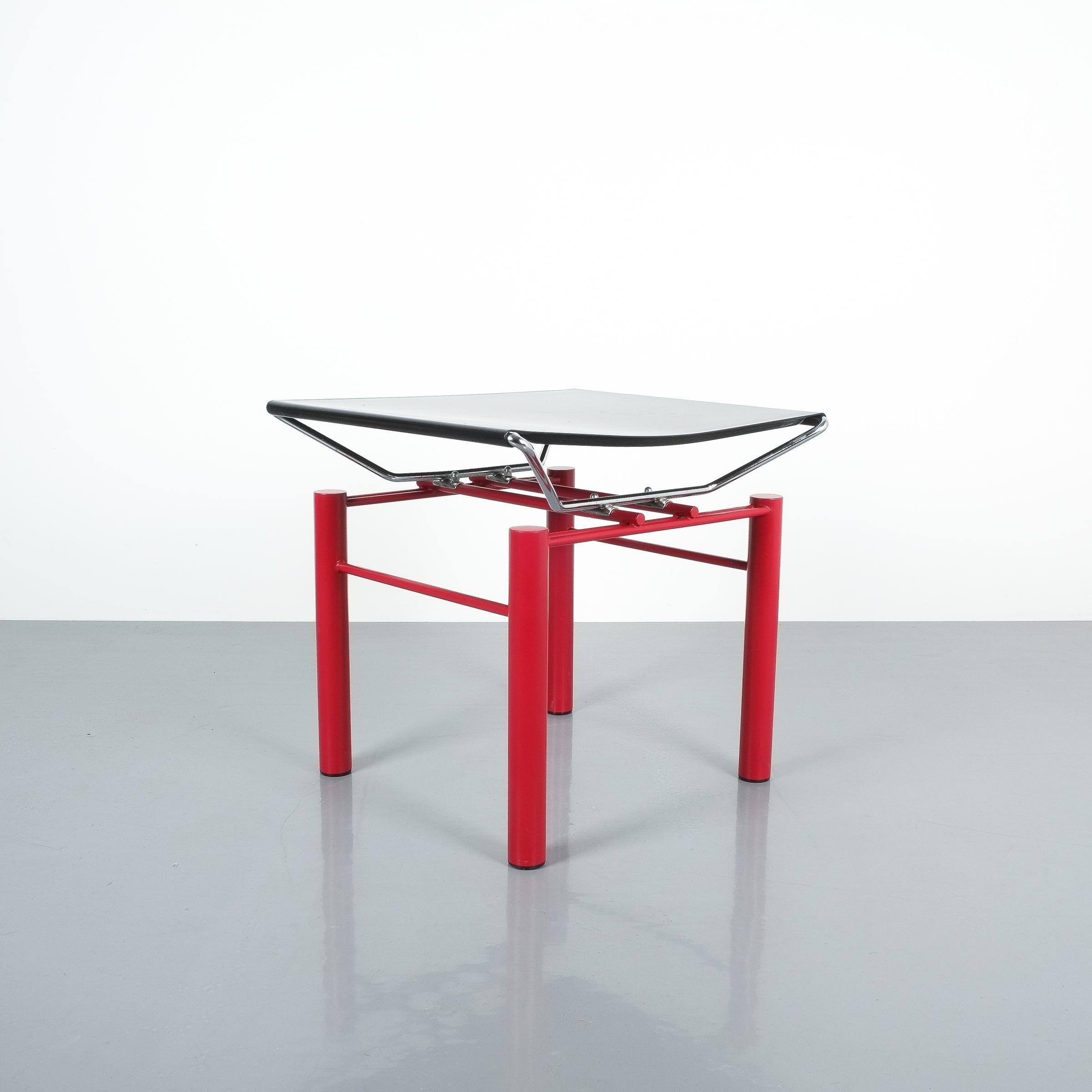 Hans Ullrich Bitsch side table Series 8600, circa 1980. Postmodern classic with black metal table top and highly delicate metal joints. Good original condition with minor wear, some scratches on the black top and color losses.