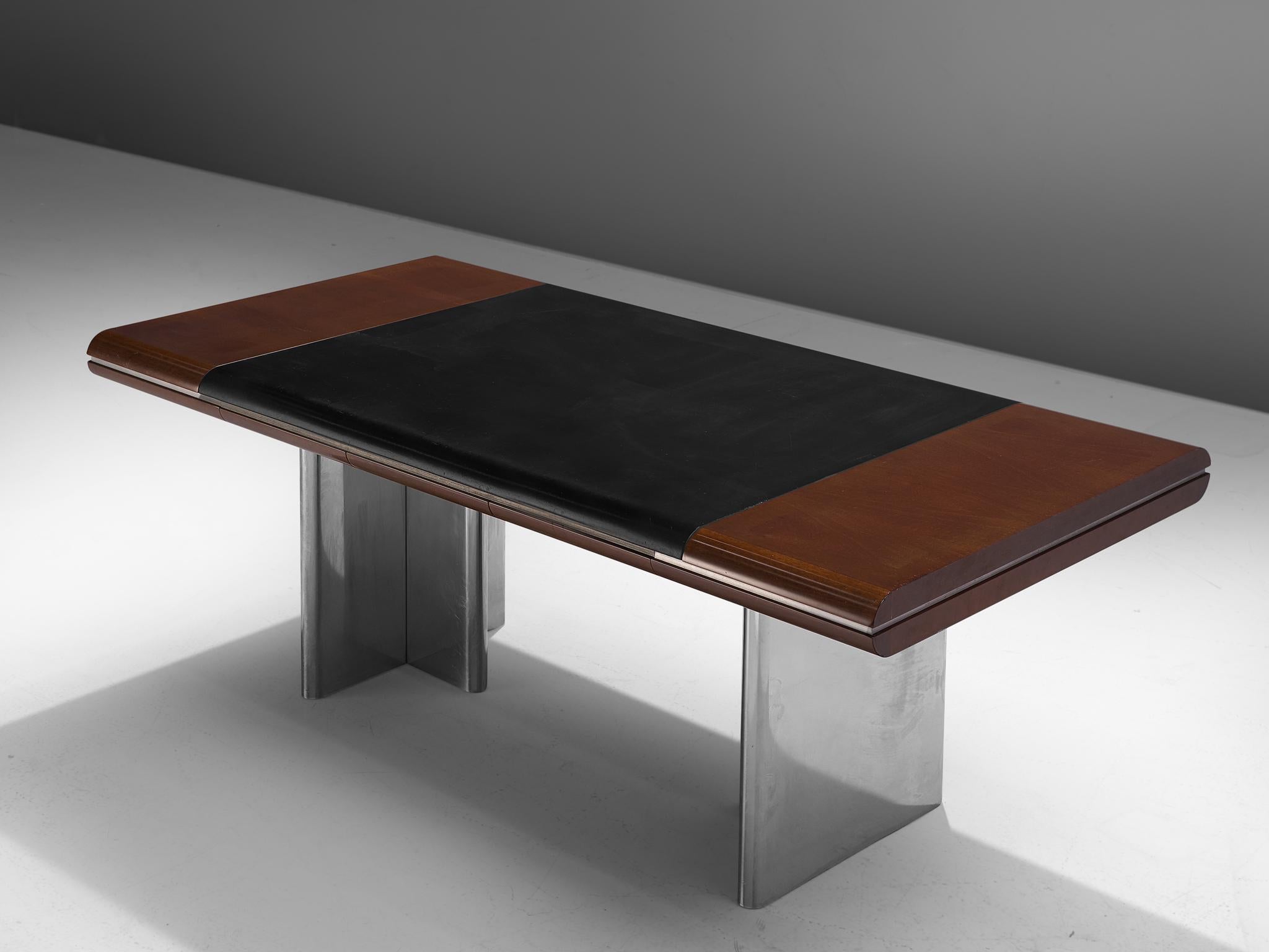 Hans Von Klier for Skipper, office table, mahogany, leather and metal, Italy, 1970s.

Modern desk designed by Hans Von Klier for Skipper, Italia. The table consists of a rectangular shaped wooden top with a steel strip and inlayed with black