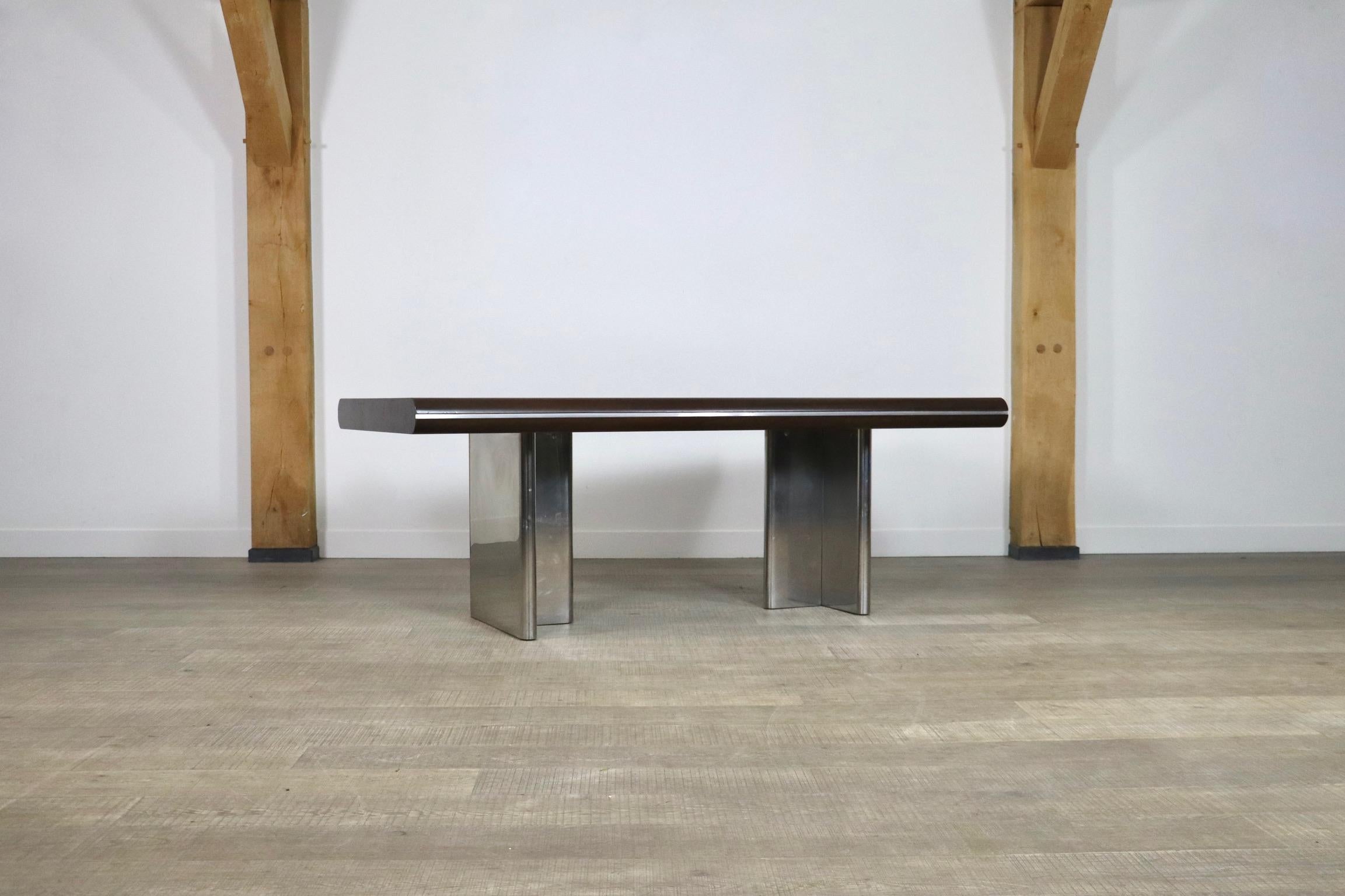 Impressive dining table designed by Hans von Klier. A striking combination of differently textured materials in two colors makes this desk an intriguing piece. The two t-shaped legs in chromed metal add a highly modern and also architectural appeal
