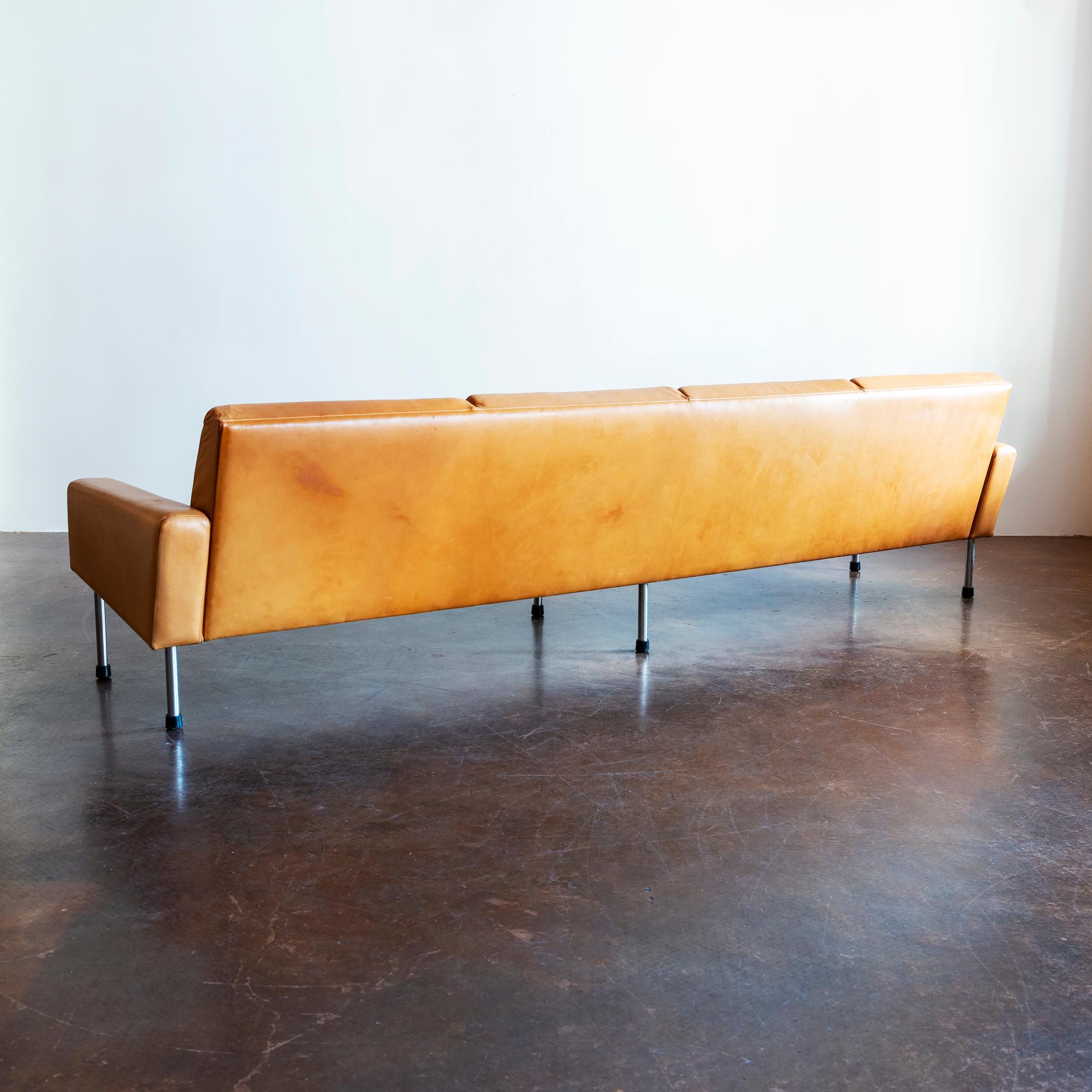 Hans Wegner freestanding four-seat Airport sofa, model AP 34/4, in cognac patinated leather. Designed in 1954 and manufactured by AP Stolen, Denmark, 1960s.
