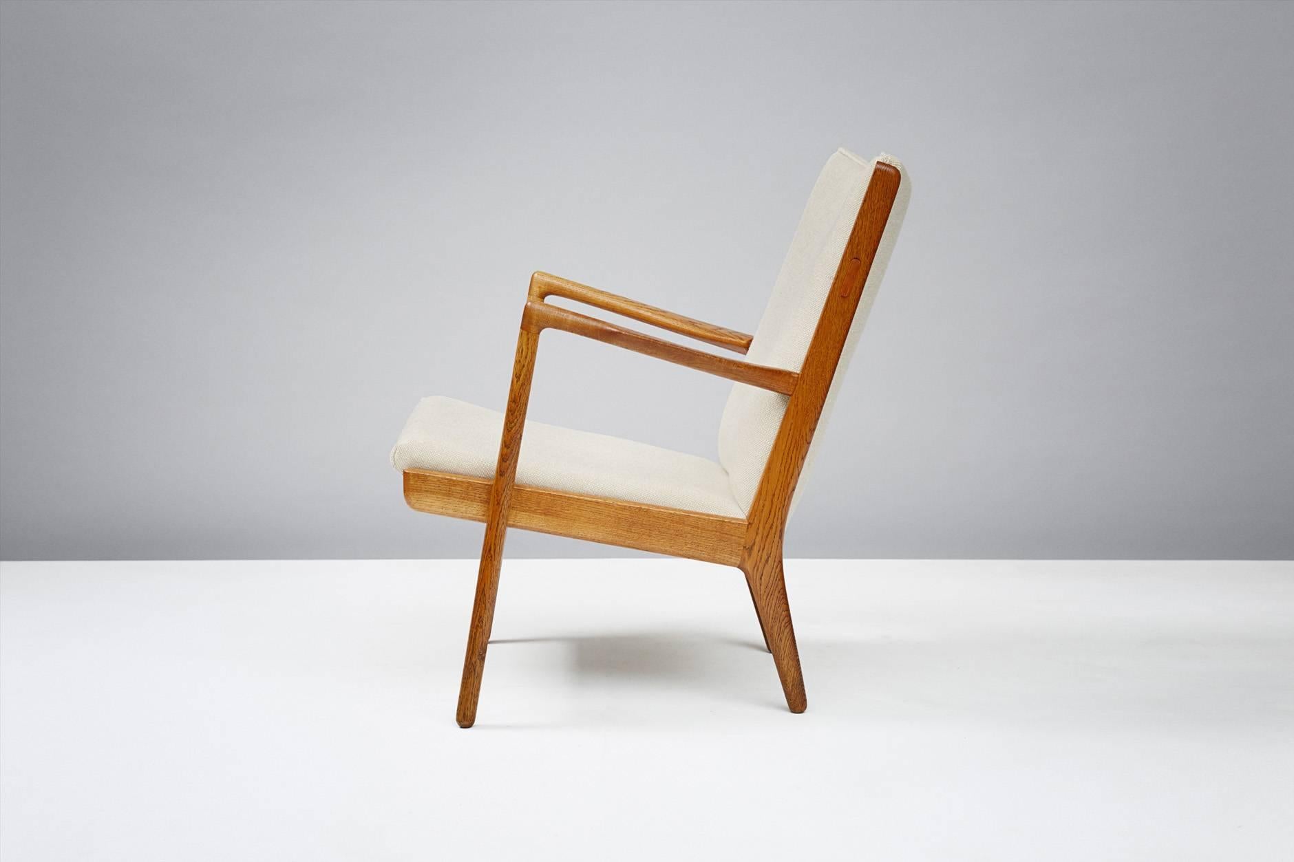 Hans J. Wegner AP-16 chair, 1952. Produced by A.P. Stolen, Denmark. Rare easy chair in oak with new Kvadrat Hallingdal wool fabric.
