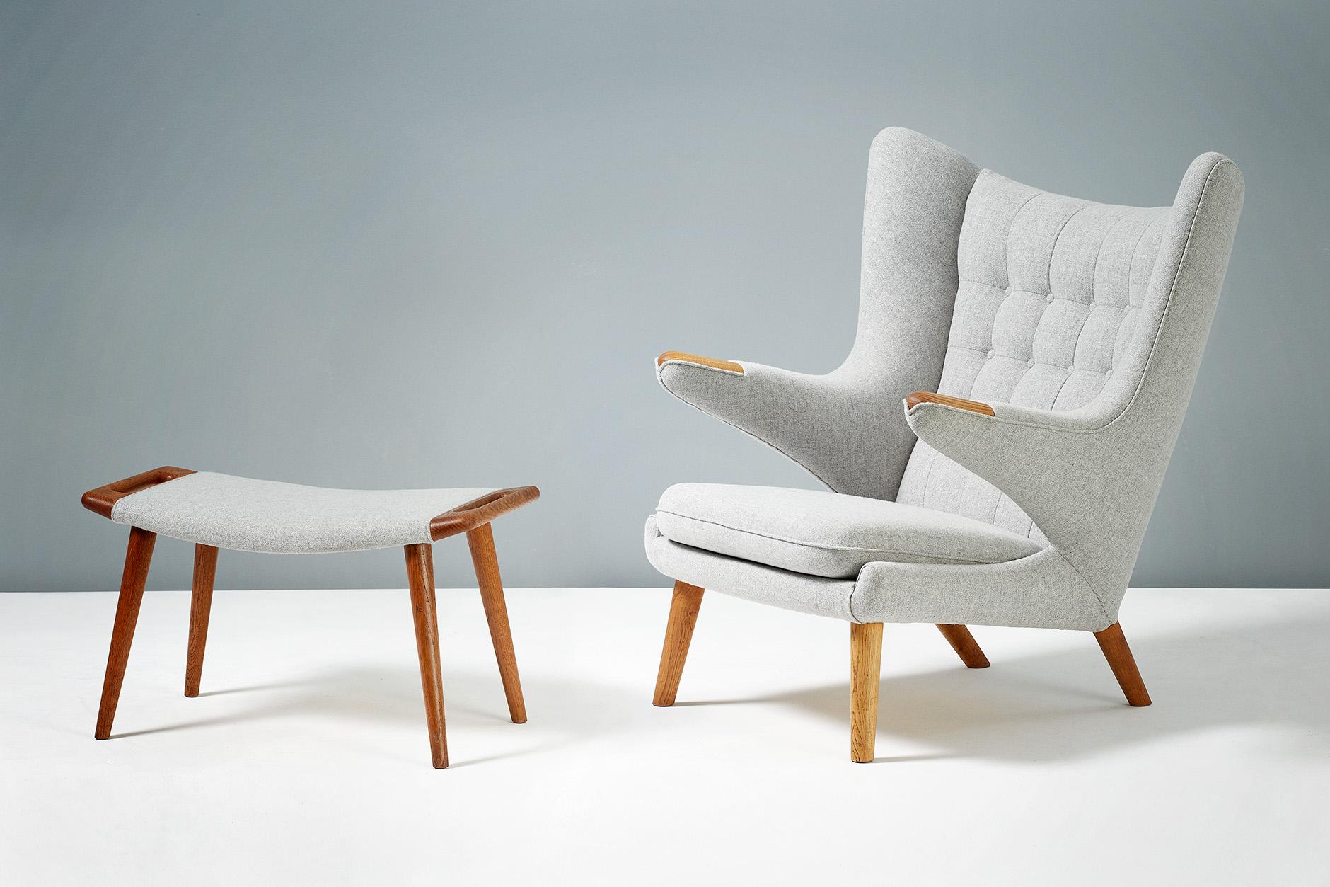 Hans J. Wegner

AP-19 Papa Bear chair and AP-29 ottoman, 1953

One of Wegner's most iconic designs. Produced by A.P. Stolen, Denmark. Oak 'paws' and legs on the armchair and matching oak legs and handles on the ottoman. These examples have been