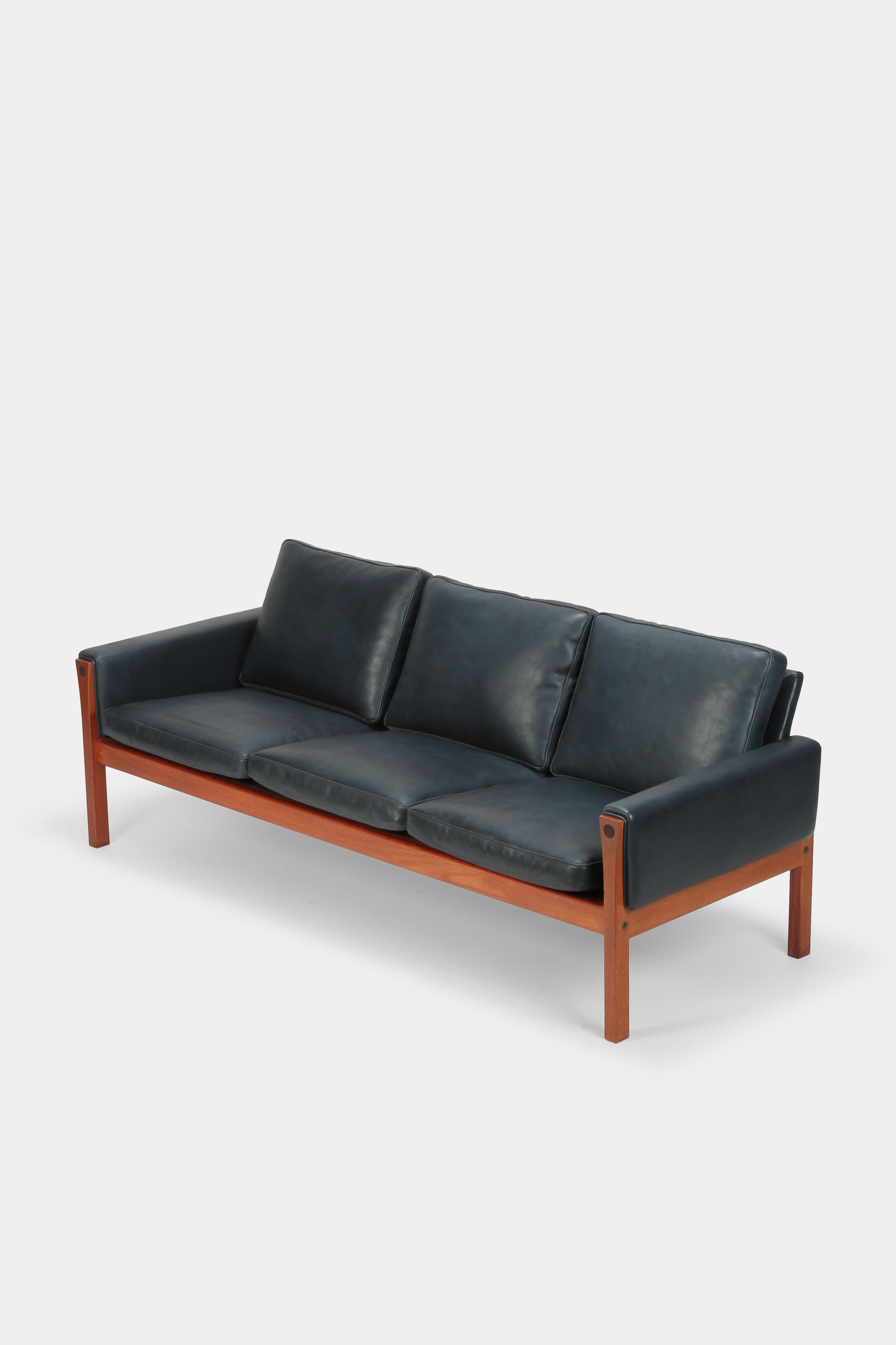 Hans Wegner for AP Stolen, manufactured in Denmark in the 1960s. Typically understated design by the Danish master, sleek and reduced lines, luxuriously covered with the finest leather (also manufactured in the nineteen sixties). Supremely
