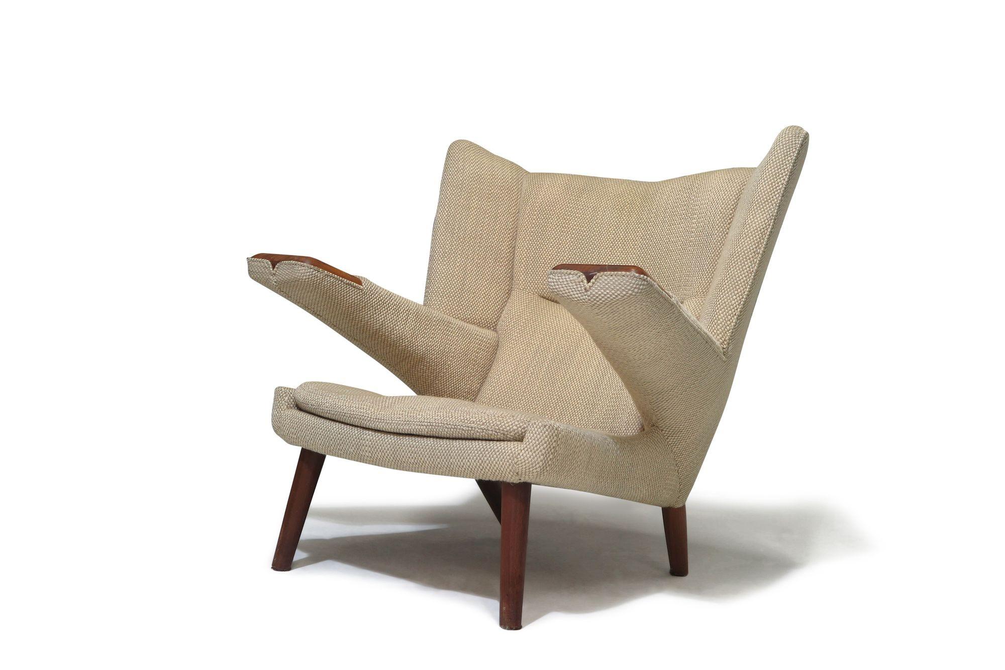 Pair of Hans Wegner AP69 Lounge chairs, a rare, limited production lounge chair designed by Hans Wegner, for A.P.Stolen, 1968-1969.
Hardwood frames with wide teak arm rests. Upholstered in the original Cobblestone fabric.  
Measurements 
W 36.75'' x