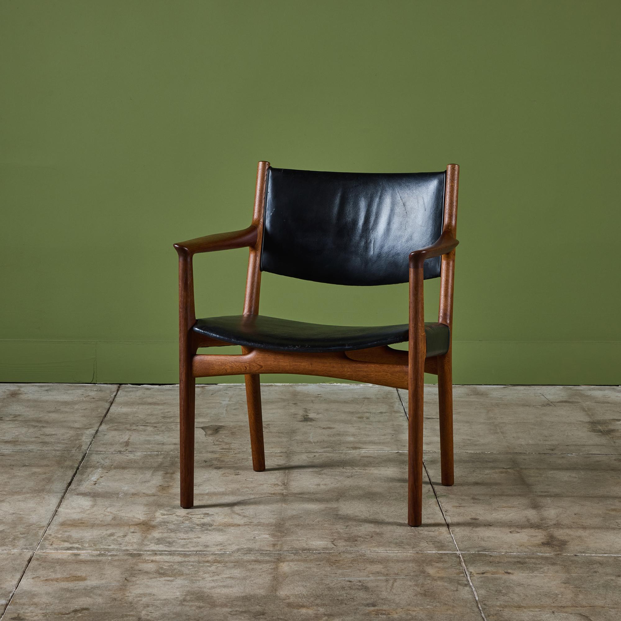 Hans J. Wegner oak armchair c.1950s, Denmark, for Johannes Hansen. The rare model JH-515 features a black leather backrest and seat.
Stamped Johannes Hansen, COPENHAGEN, DENMARK.

Dimensions
25.25” width x 21.25” depth x 31.75” height; 16.5