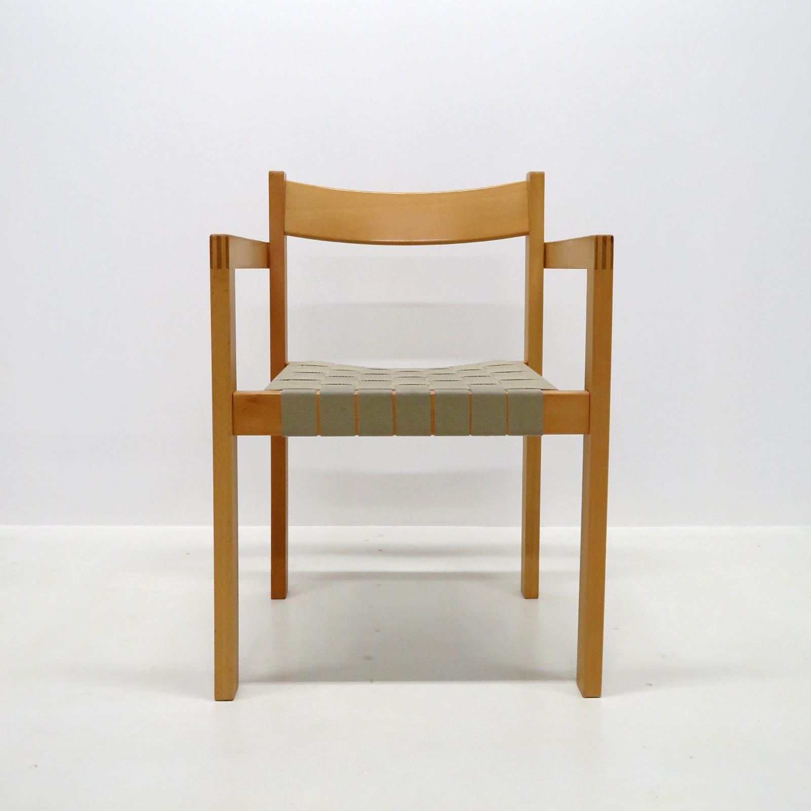 Wonderful 1970s side chairs 'Koldinghus' by Hans Wegner, with arms, in oak with straps of hemp, stackable, very comfortable. 

Priced individually.