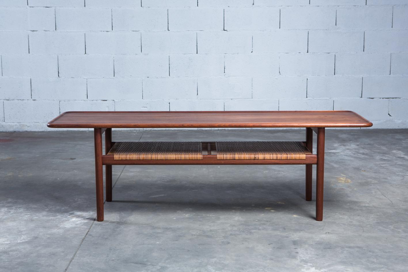 Hans Wegner AT-10 coffee table produced by Andreas Tuck, Denmark, 1950s. Solid teak and handwoven cane. Very good condition. Branded manufacturer’s mark to underside. Ships worldwide.

Dimensions: 160 x 51 x 50 cm [D x W x H].




UK customers