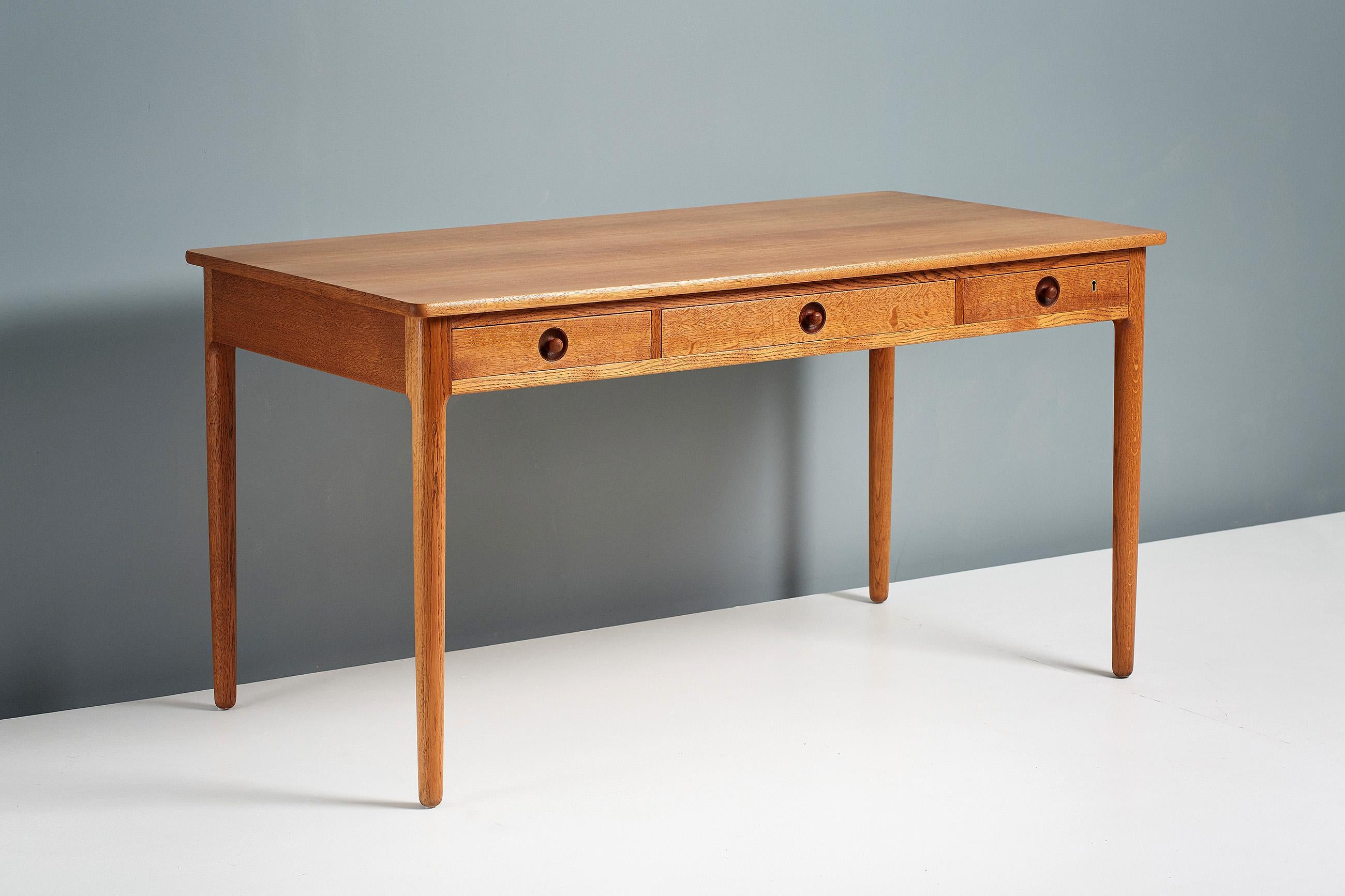 Hans Wegner 
AT-305 desk, 1953

Oak desk from Danish icon Hans Wegner produced by master-cabinetmaker Andreas Tuck who was responsible for making most of Wegner’s best desk and table designs. The legs, drawers and frame are made from solid,