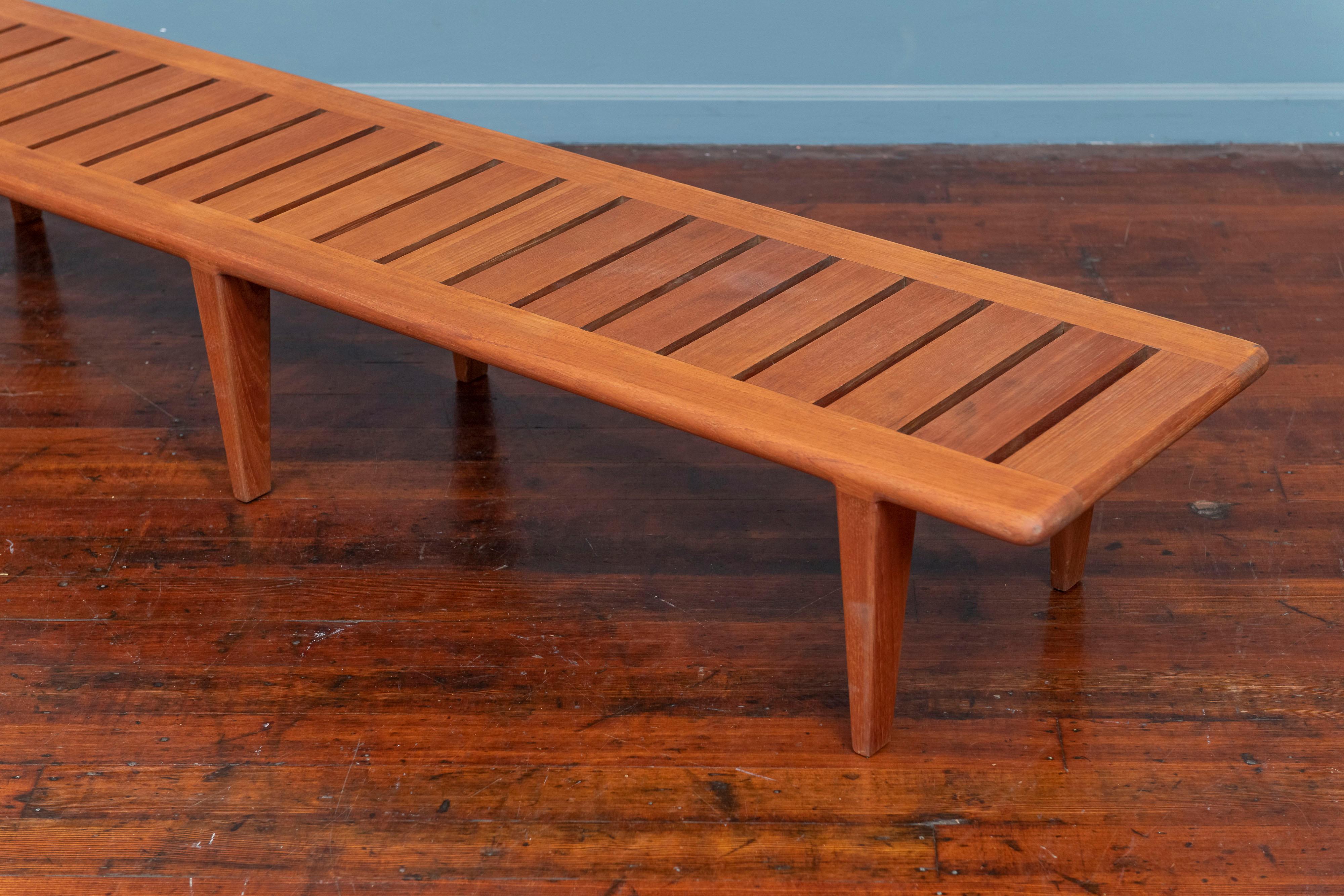 Hans Wegner slatted bench model JH 574 for Johannes Hansen, Denmark. 
High quality construction and attention to detail this bench is perfect for an entry way or under a large work of art. Made from solid teak with rounded edges and superb