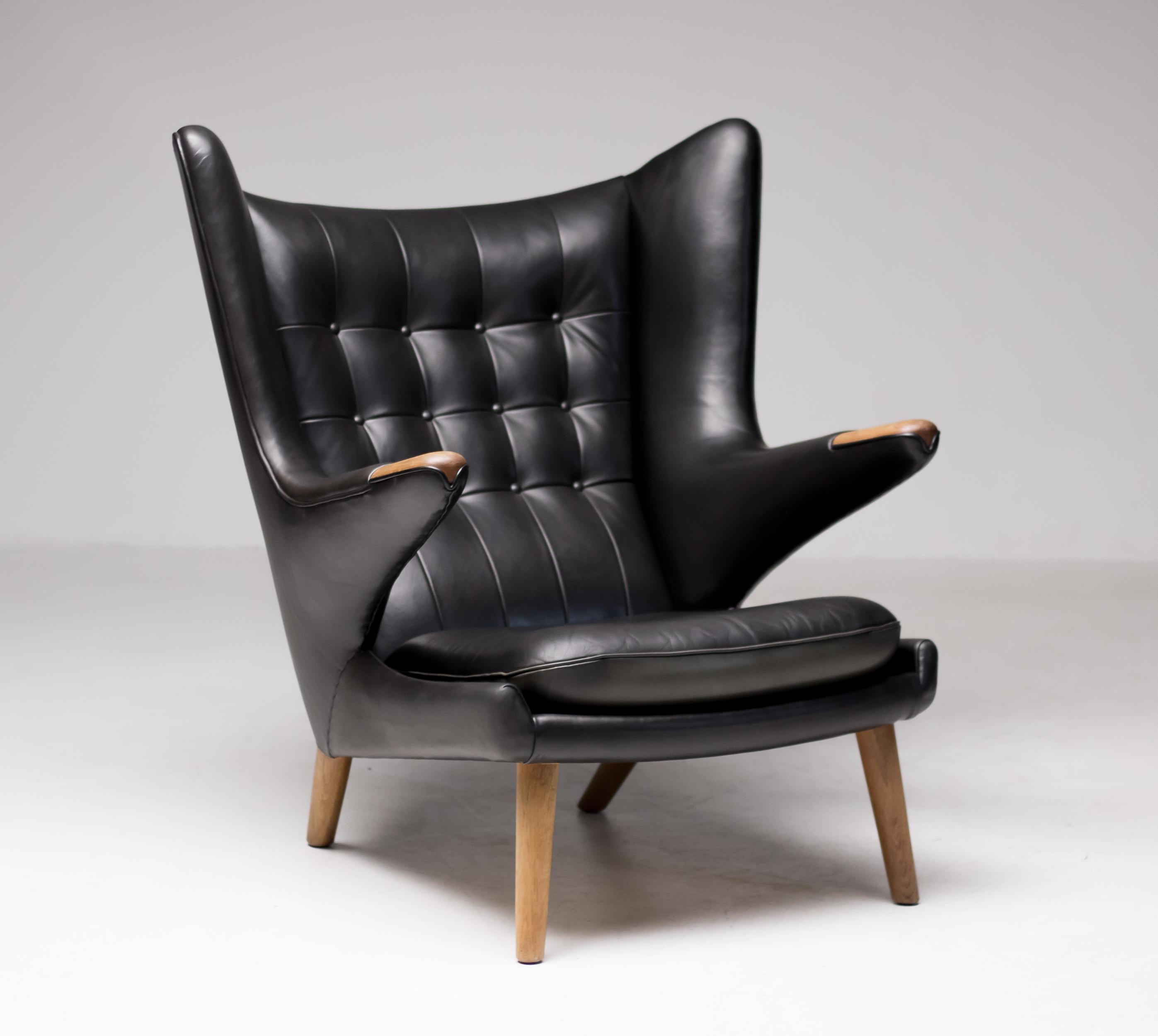 Hans J. Wegner black leather pair of Papa Bear chairs with one ottoman for A.P. Stolen, circa 1950.
Great pampered condition, the natural dye black leather is still very soft and supple.
Priced as a set.

Provenance: 
Klassik Copenhagen
Danish