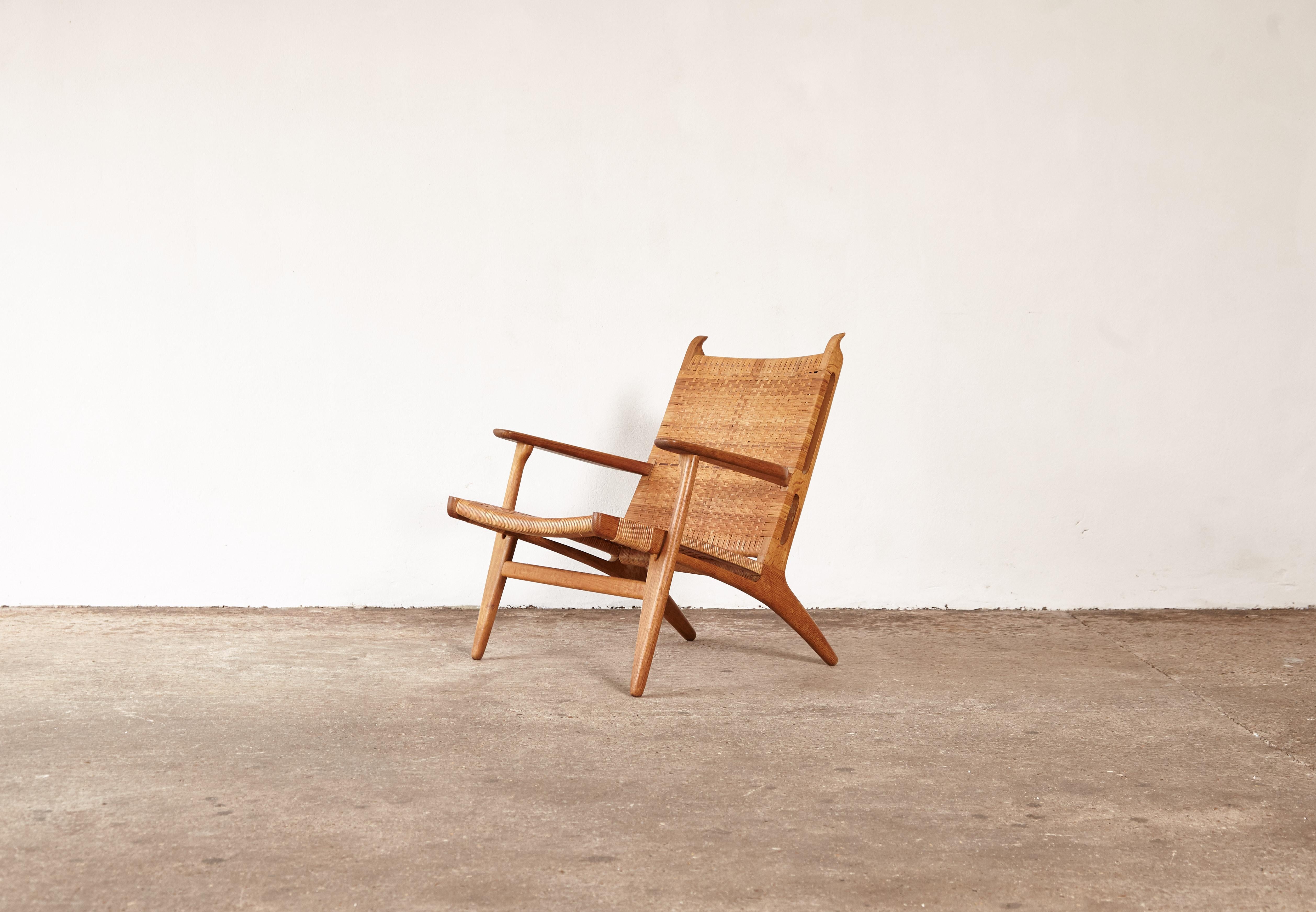 A CH-27 chair designed by Hans Wegner for Carl Hansen, Denmark, 1950s.  Stamped with makers mark.   The cane on seat has been professionally restored.   Fast shipping worldwide.