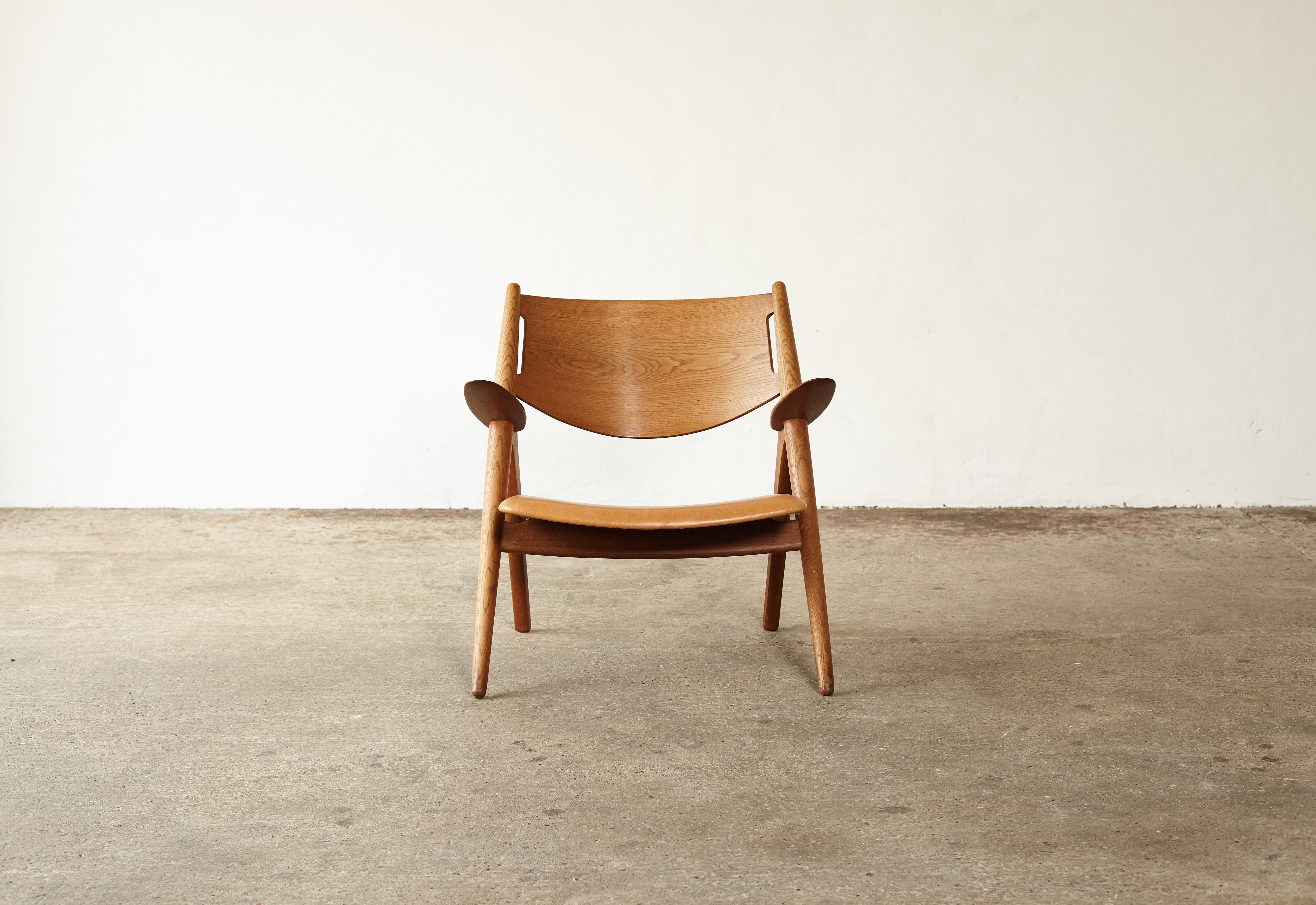 Mid-Century Modern Hans Wegner CH-28 Oak Sawbuck Armchair, 1950s, Denmark