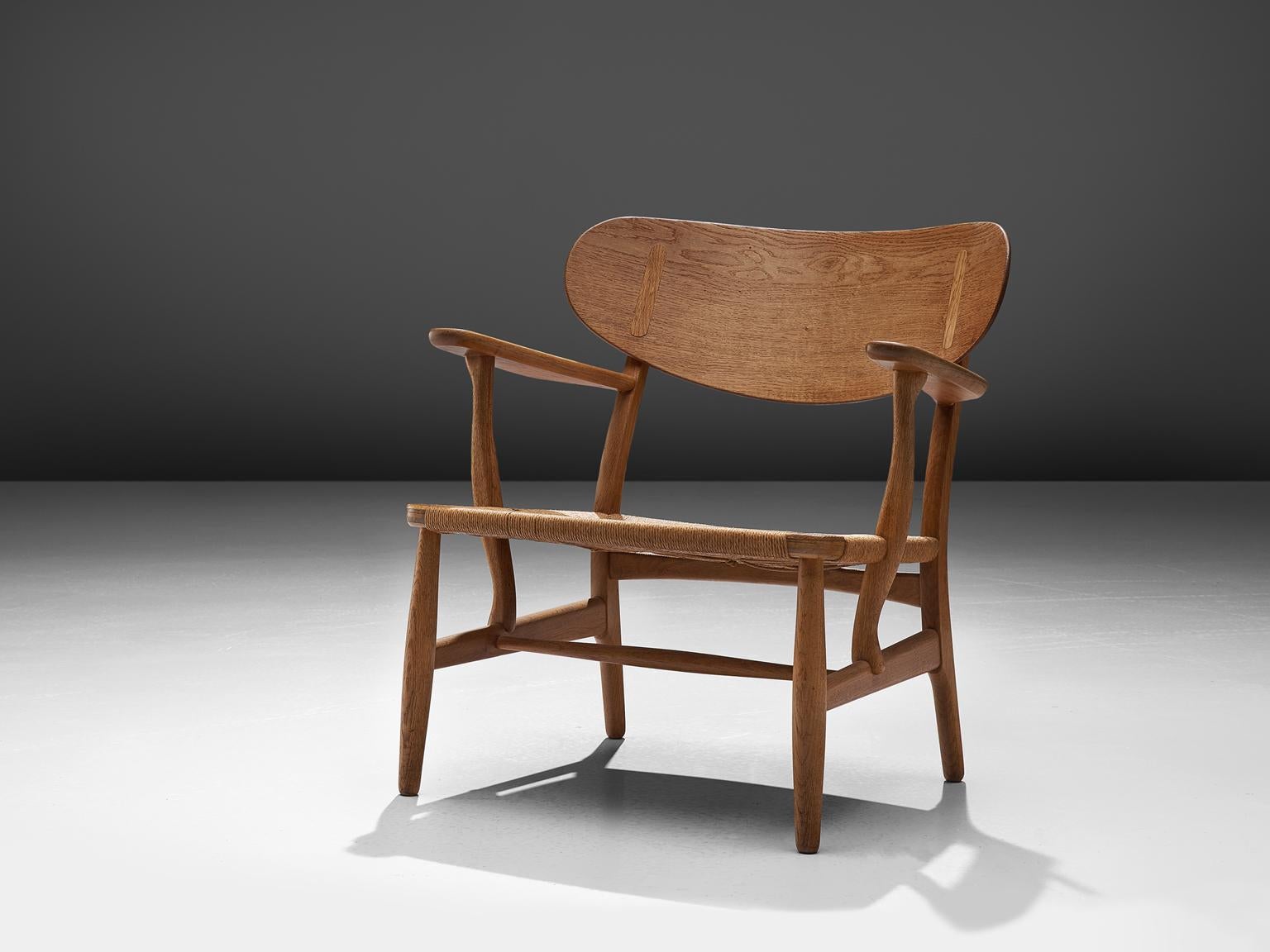 Hans J. Wegner for Carl Hansen & Søn, armchair model CH22 by Denmark, 1950.

This chair is one of Wegner's early masterpieces for Carl Hansen. The chair bears the first number of a highly interesting collection that was realized during the