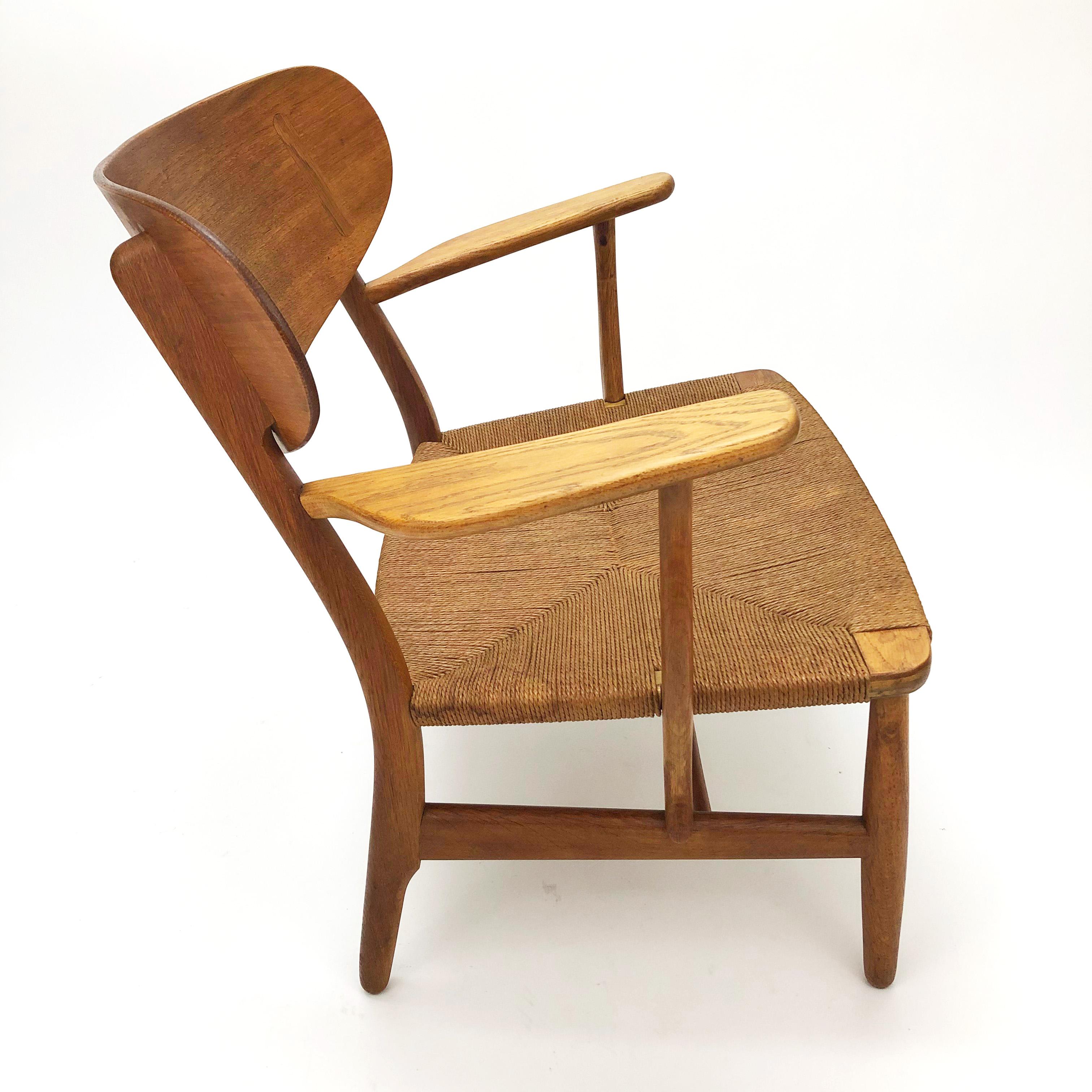 Scandinavian Modern Hans Wegner CH22 Lounge Chair in Teak and Oak