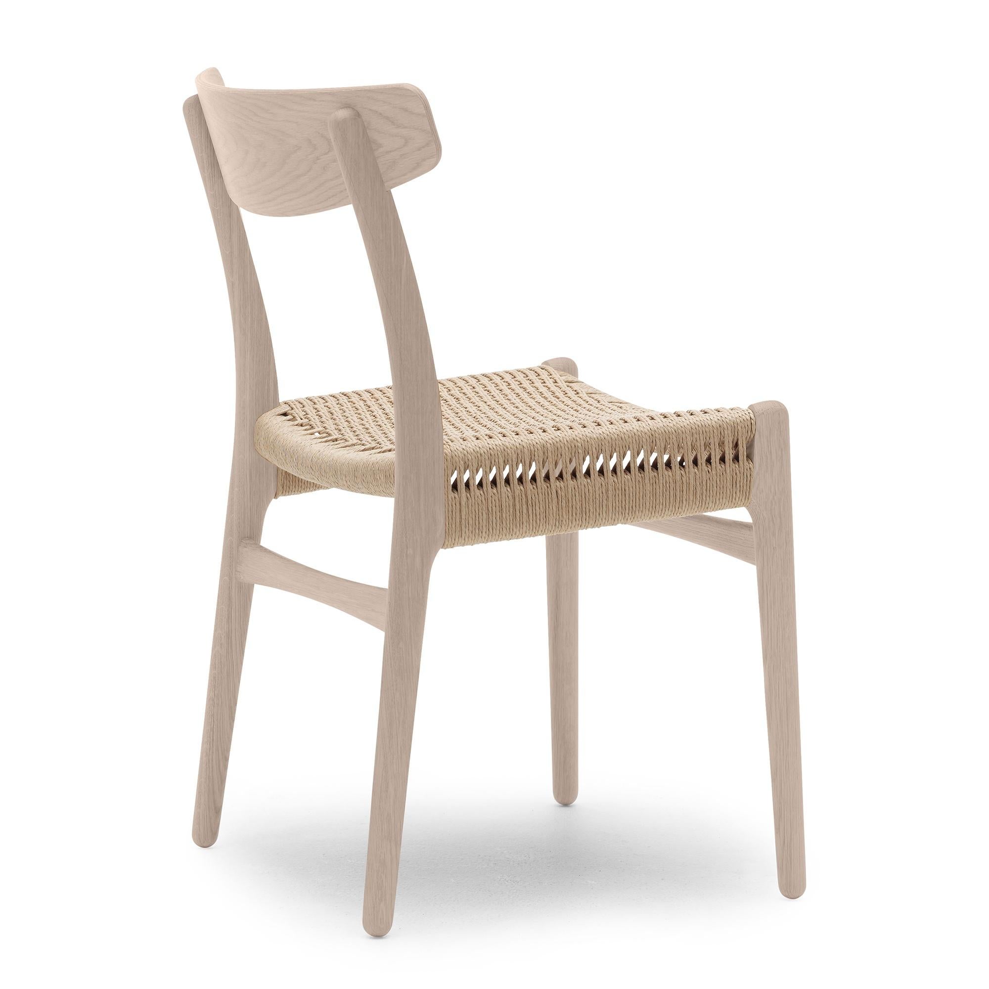 Hans Wegner 'CH23' Stuhl aus Eiche Seife und natürlichem Papierkordel für Carl Hansen & Sohn

Die Geschichte der dänischen Moderne beginnt im Jahr 1908, als Carl Hansen seine erste Werkstatt eröffnet. Sein Engagement für Schönheit, Komfort,
