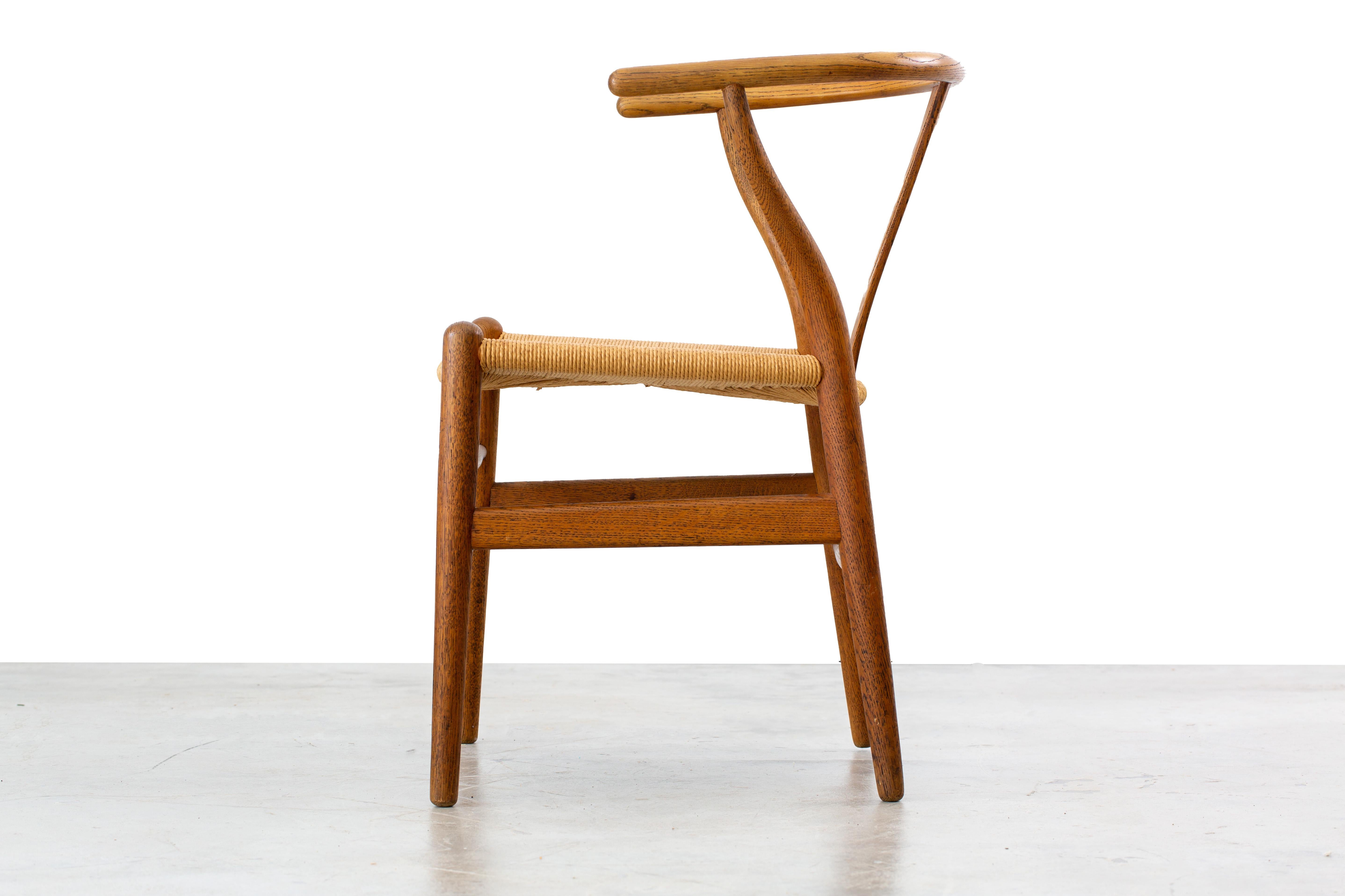 Mid-Century Modern Hans Wegner CH24 Wishbone chair in oak and papercord circa 1953 Illums Bolighus