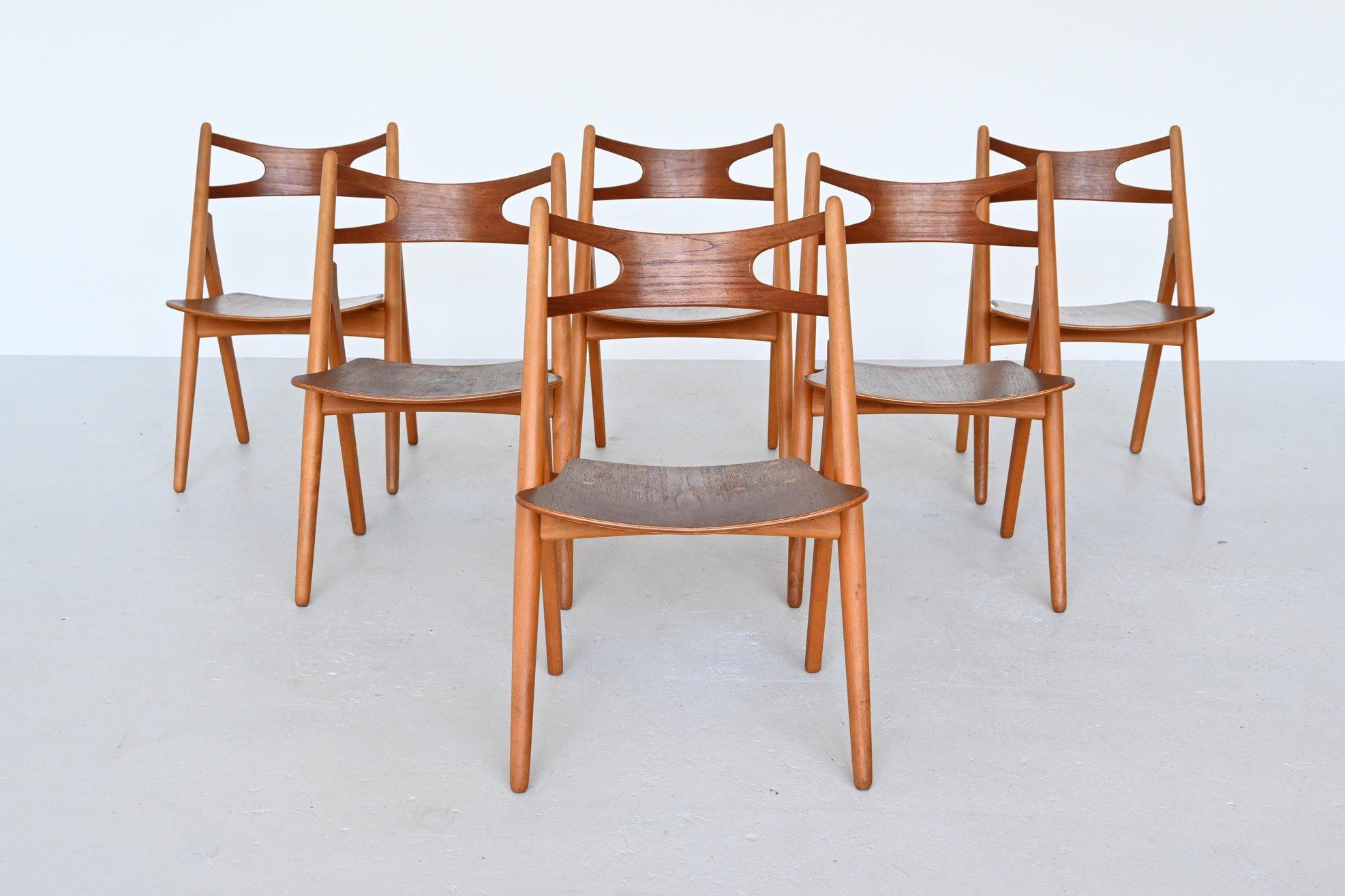 Amazing set of 6 iconic model CH29 dining chairs designed by Hans J. Wegner and manufactured by Carl Hansen & Søn, Denmark 1952. This design Classic is also called “Sawbuck chair” because the model resembles a sawhorse. The sawhorse was