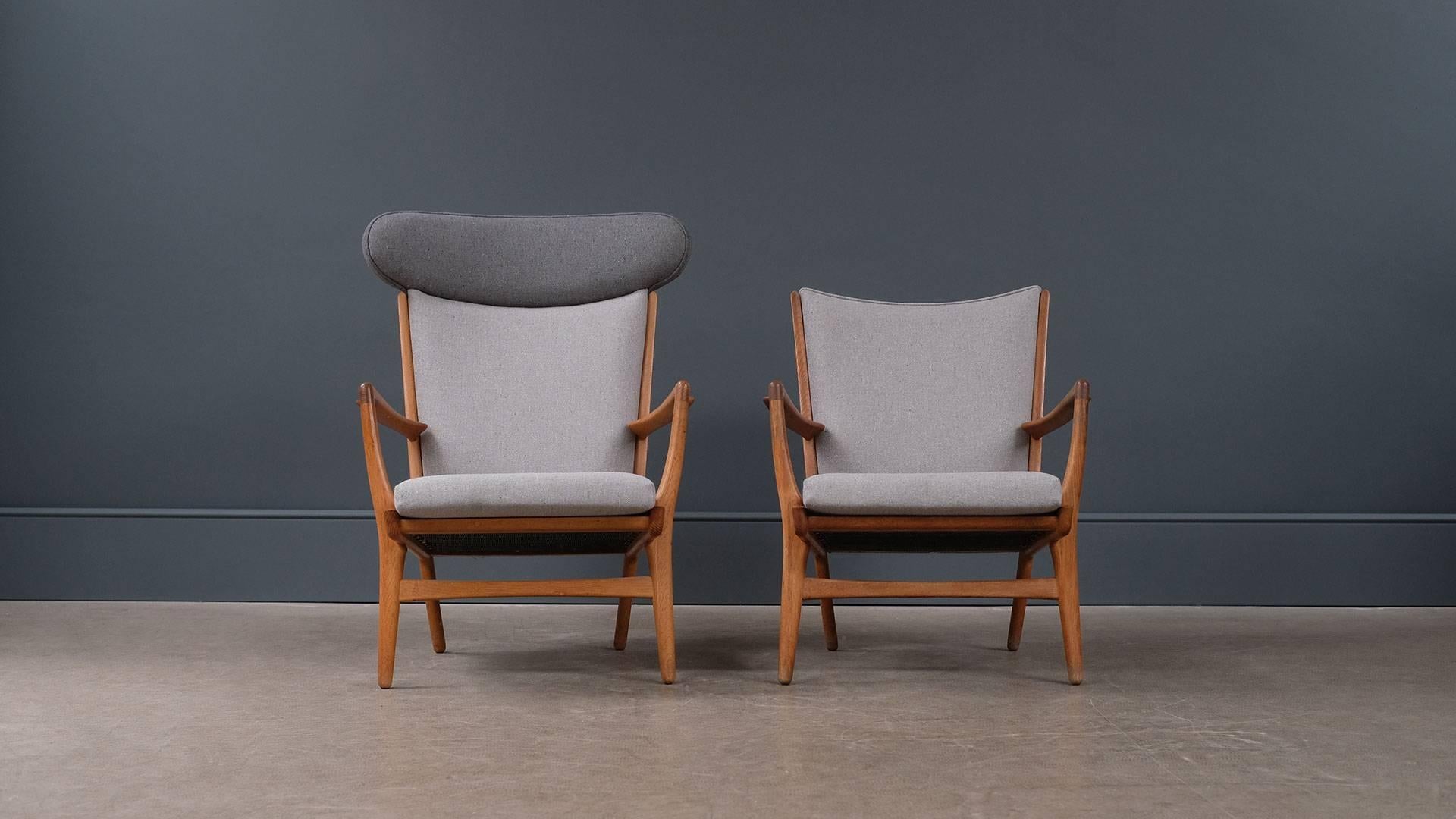 Amazing and rare pair of AP 15/16 armchairs in sculptural solid oak designed by Hans Wegner for master cabinet maker AP Stolen in 1951, Denmark. Fully refurbished and re-upholstered in beautiful fleck fabric. Fantastic and rare pair of super