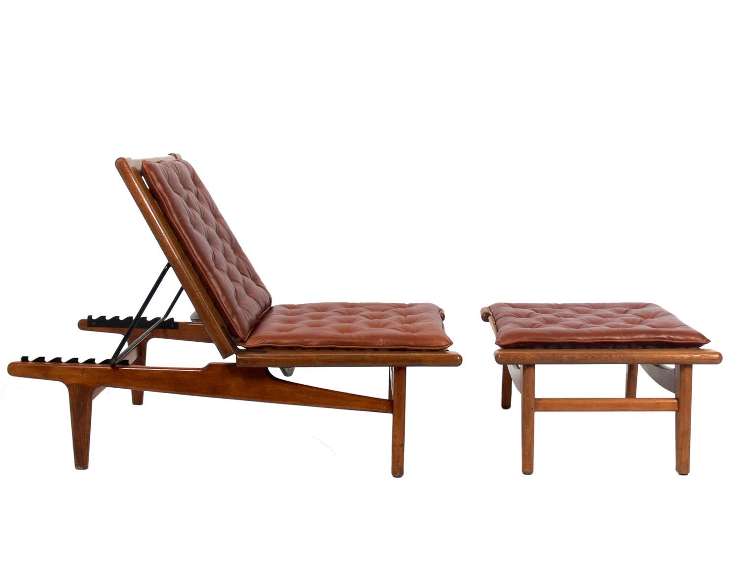 Danish modern chaise lounge and ottoman, designed by Hans Wegner for GETAMA, Denmark, circa 1950s. Leather cushions reupholstered in a buttery soft cognac color leather. Signed with branded manufacturer’s mark to underside of each element: [GETAMA