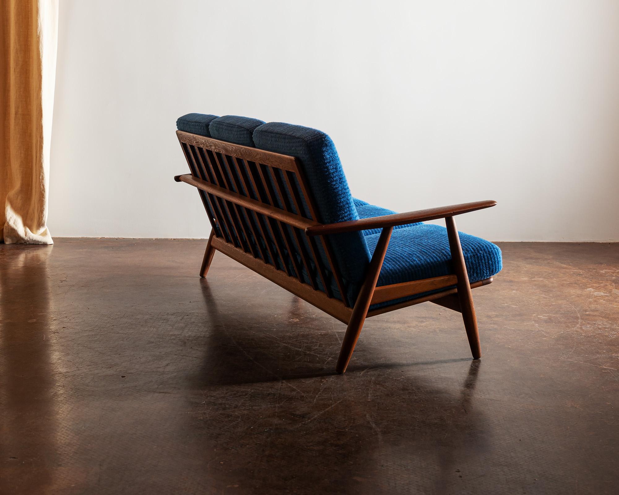 Original Hans Wegner GE-240 cigar sofa. Recently reupholstered in Sandra Jordan Prima Alpaca in Periwinkle Stripe. Teak frame in excellent condition. Produced by GETAMA, 1960s.