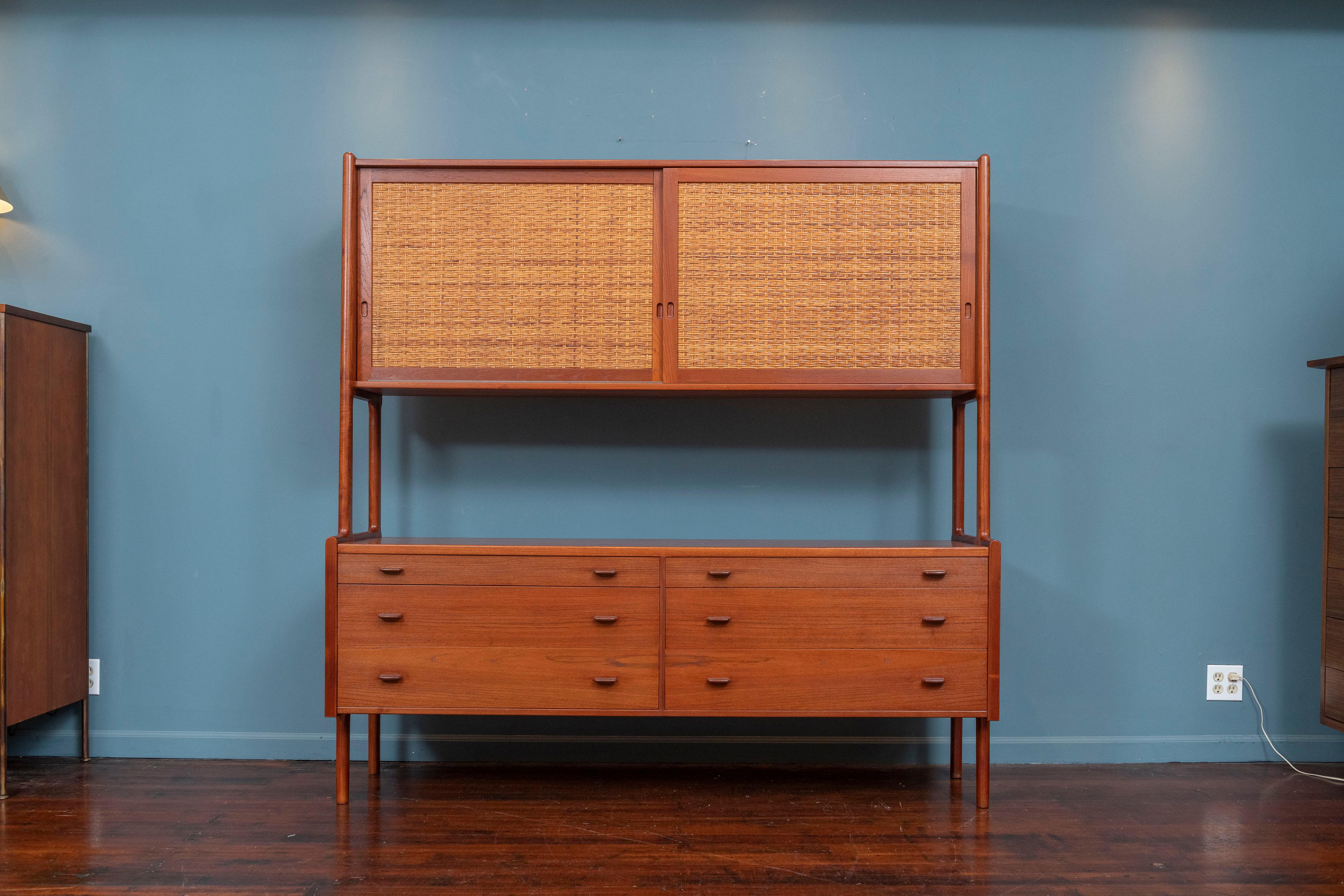 Hans Wegner design credenza or hutch for RY Mobler, Denmark. High quality construction and design with two cane sliding doors revealing adjustable shelves on top and six drawers below for lots of storage.