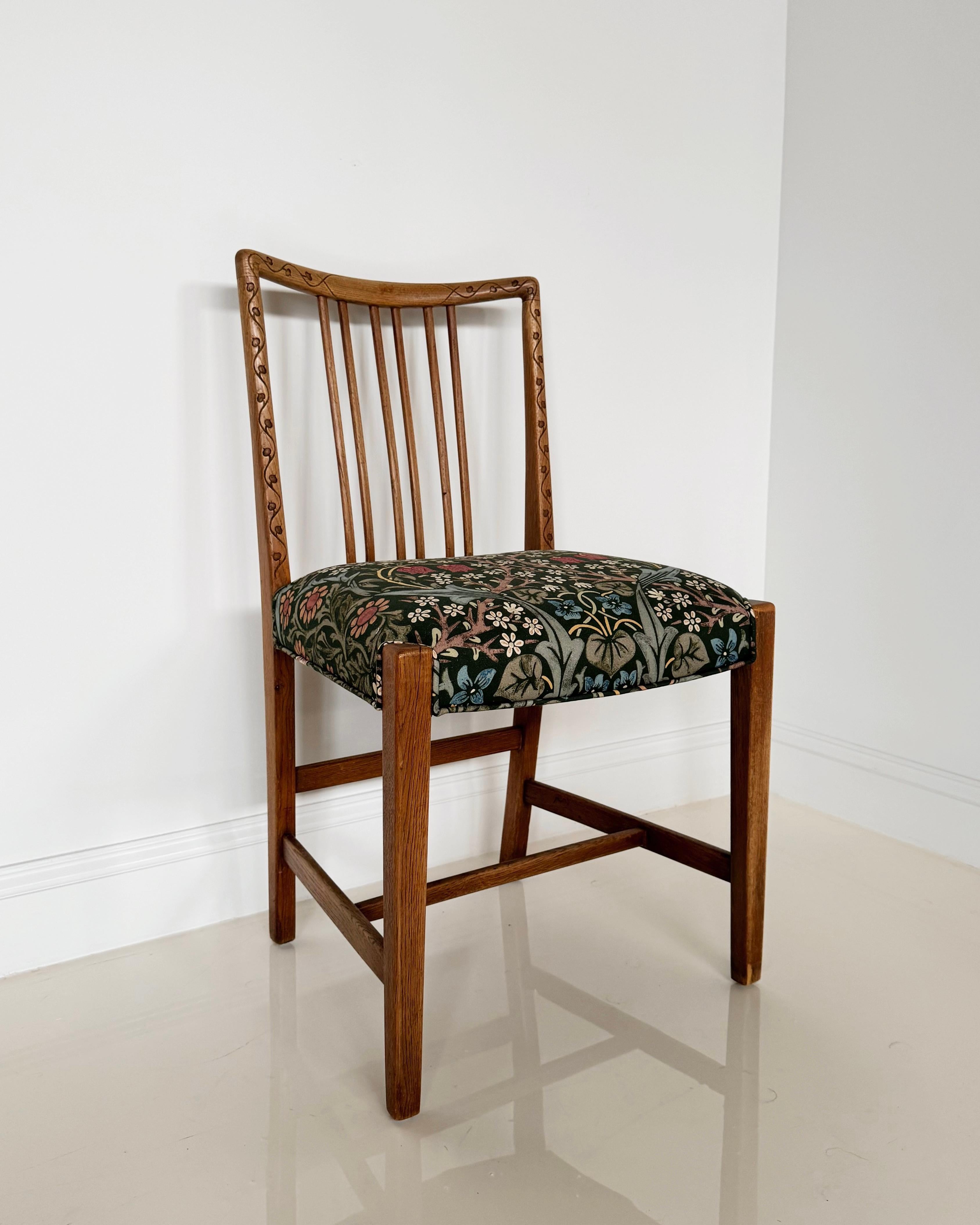 This rare dining chair was such a find! The oak is in wonderful shape. We thought William Morris's Blackthorn fabric would be the perfect complement to the subtle carved floral details on the back of the chair.