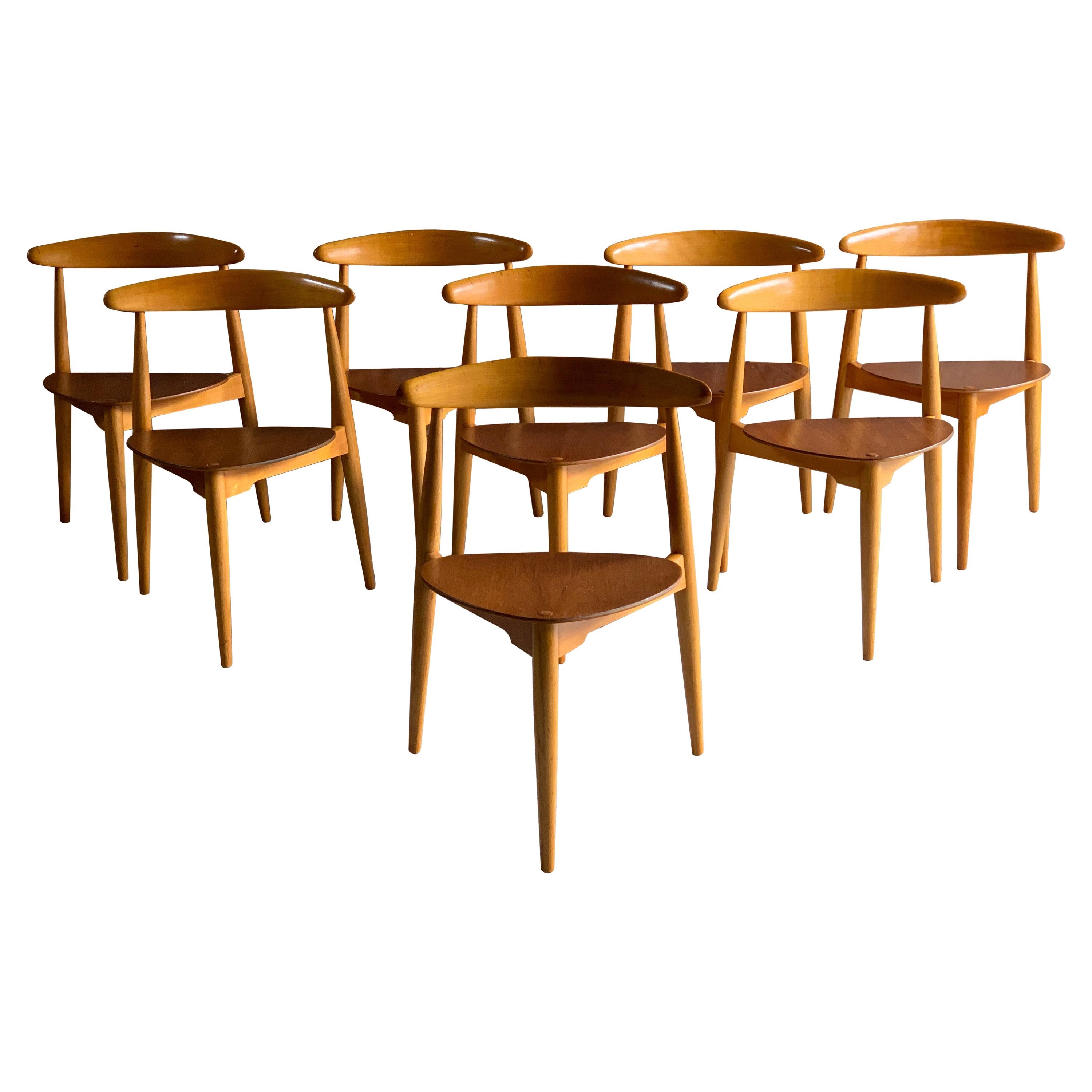 Hans J Wegner ‘The Heart' dining chairs made in Denmark by Fritz Hansen circa 1950, eight ‘heart’ chairs Model FH4103 made from teak and beech frames, the chairs are all stackable.

Condition report: The chairs have been completely stripped back,