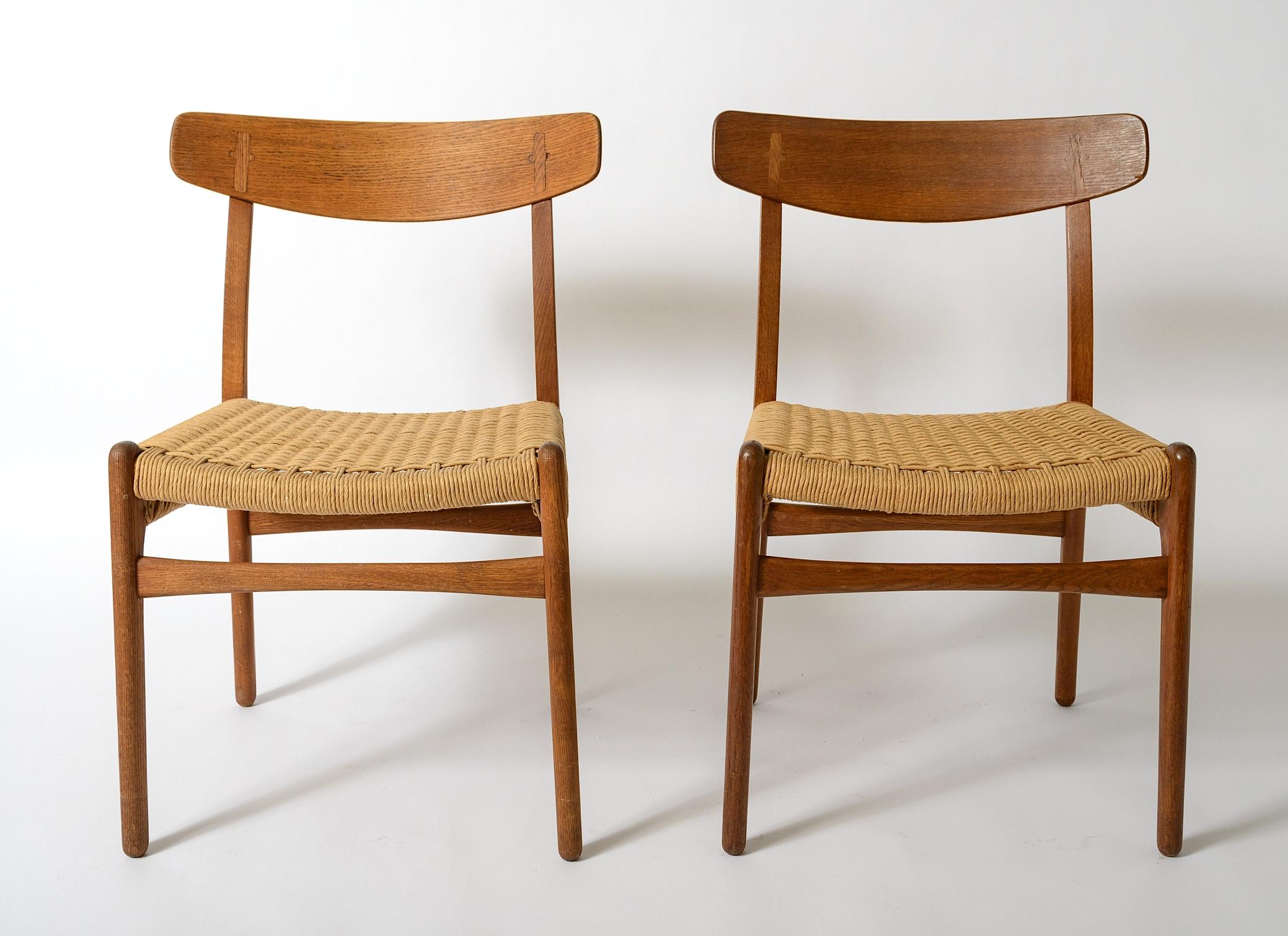 A pair of hans Wegner Teak Chairs
Original Paper Cord Seats
Original oiled finish to Frames
Manufactured by Carl Hansen and Son
Branded Signature