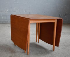 Hans Wegner Drop Leaf Boat Shaped Dining table in Teak and Oak for Andreas Tuck