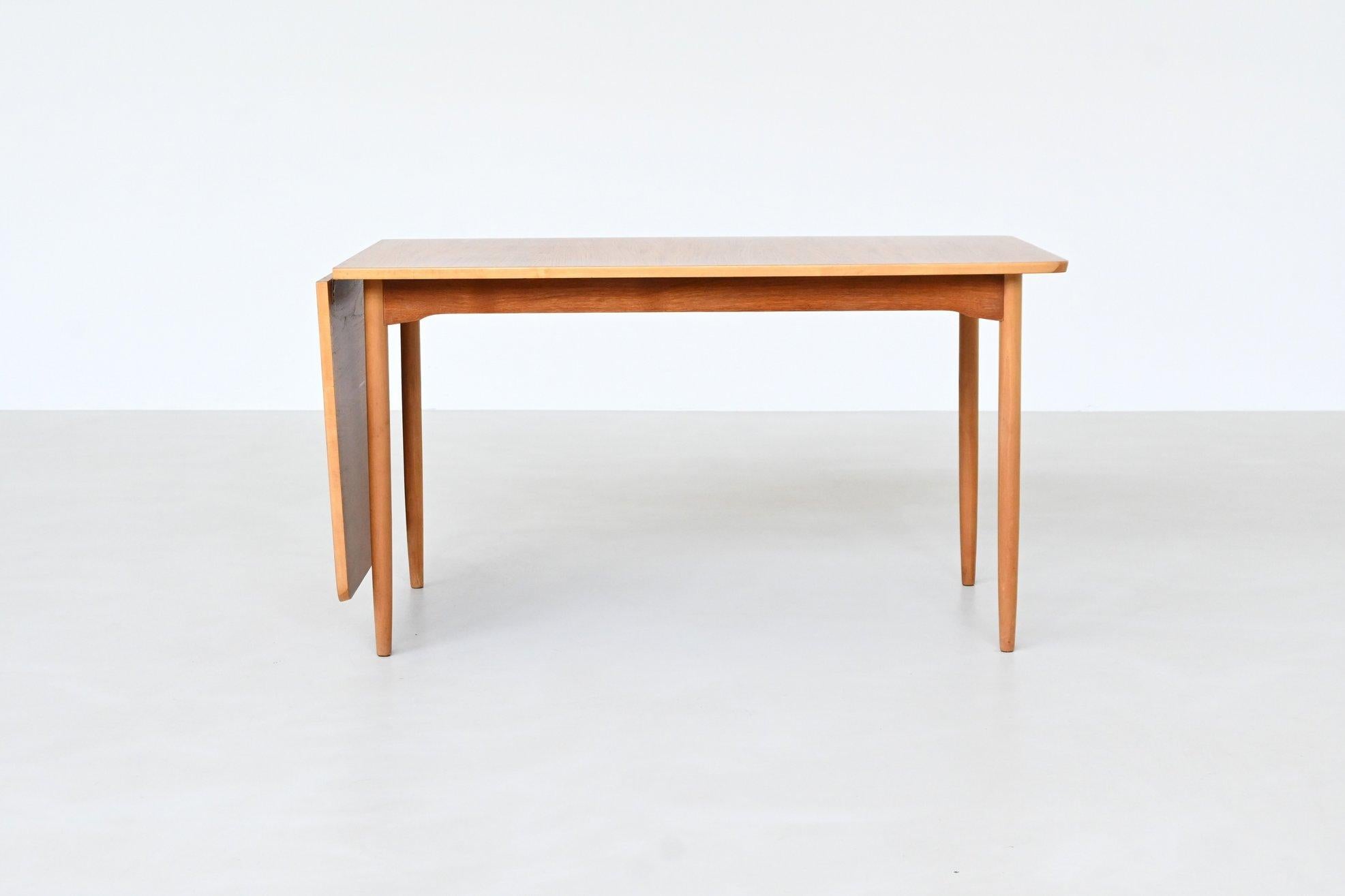 Scandinavian Modern Hans Wegner drop-leaf dining table in beach and teak Denmark 1950 For Sale