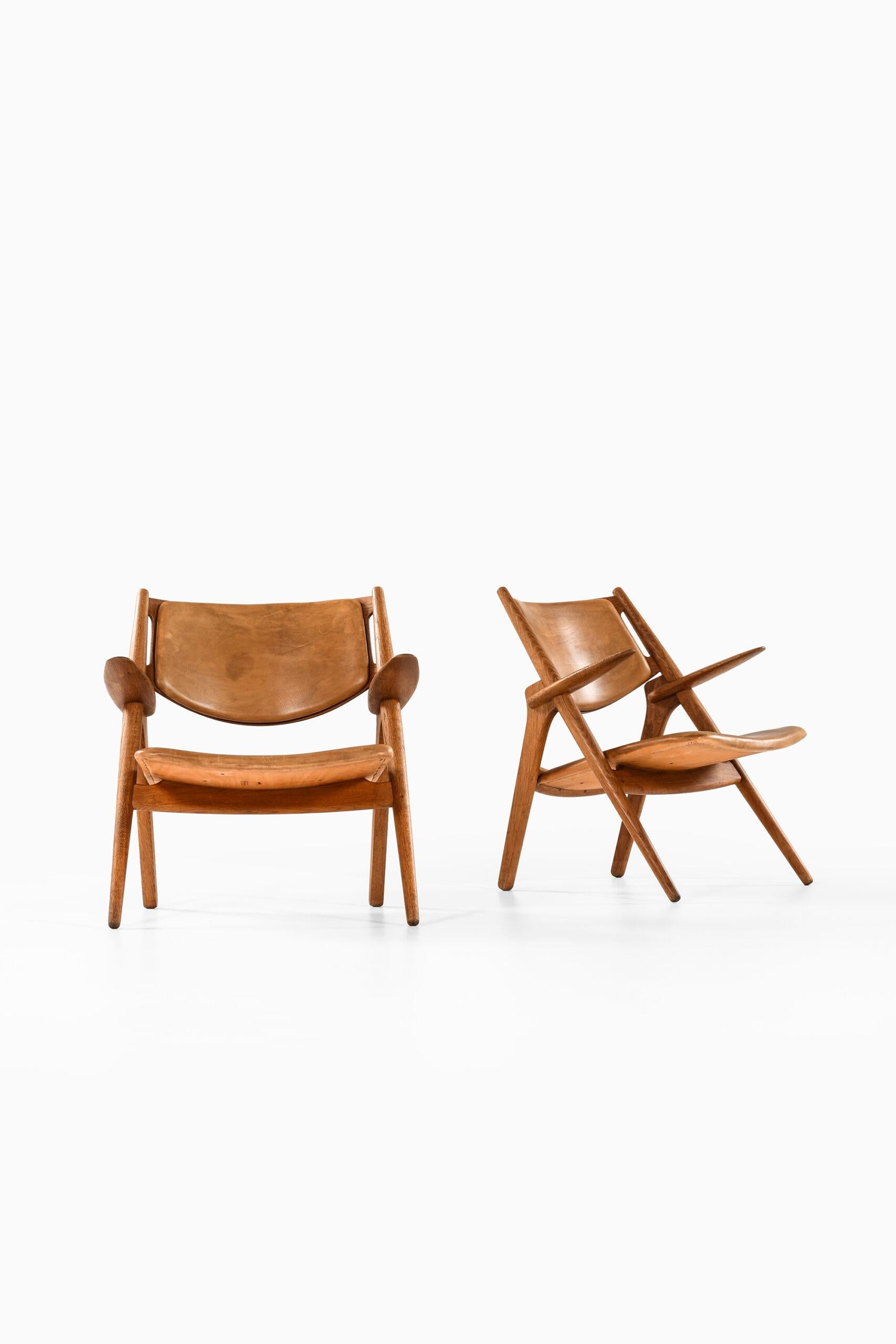 Rare pair of easy chairs model CH-28 designed by Hans Wegner. Produced by Carl Hansen & Søn in Denmark.