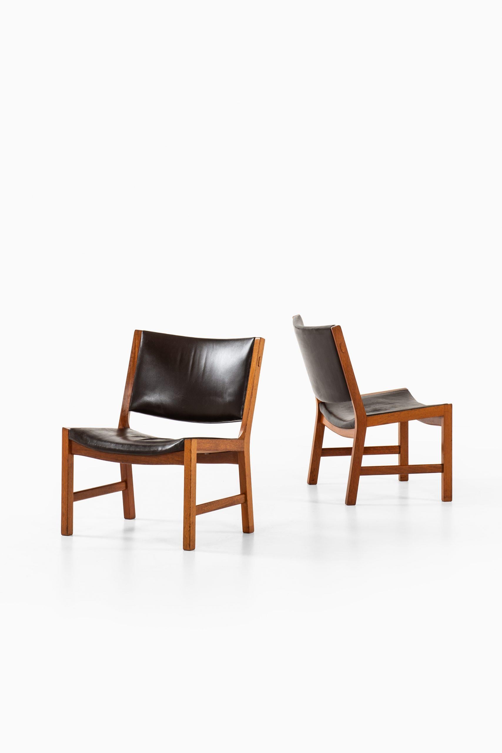 Rare pair of easy chairs model JH54 designed by Hans Wegner. Produced by cabinetmaker Johannes Hansen in Denmark.