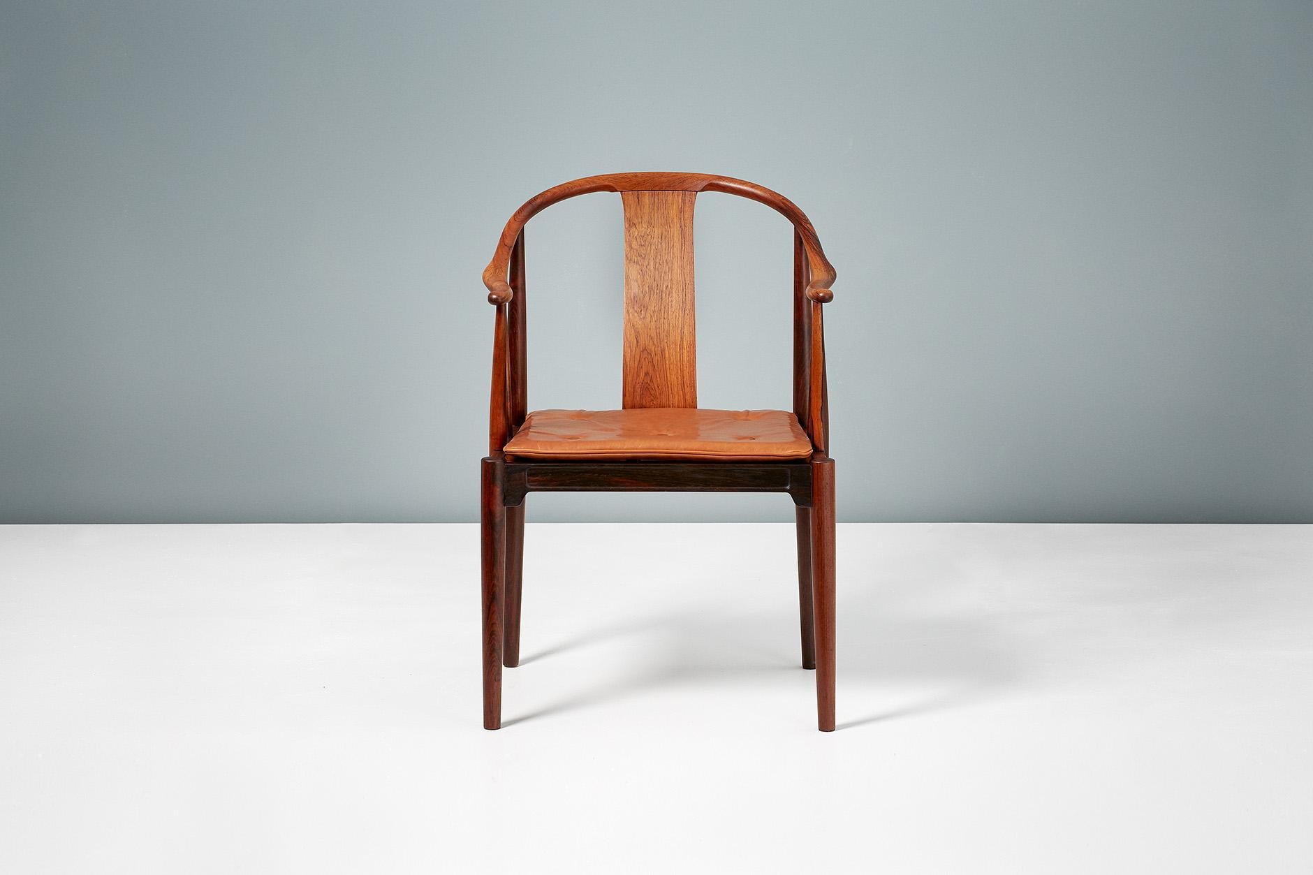 Hans J. Wegner

FH 4283 China chair, 1944

Produced by Fritz Hansen in Denmark this version in exquisite Brazilian rosewood is an incredibly rare version of this iconic design made in limited quantities in the 1960s. The loose seat cushion is