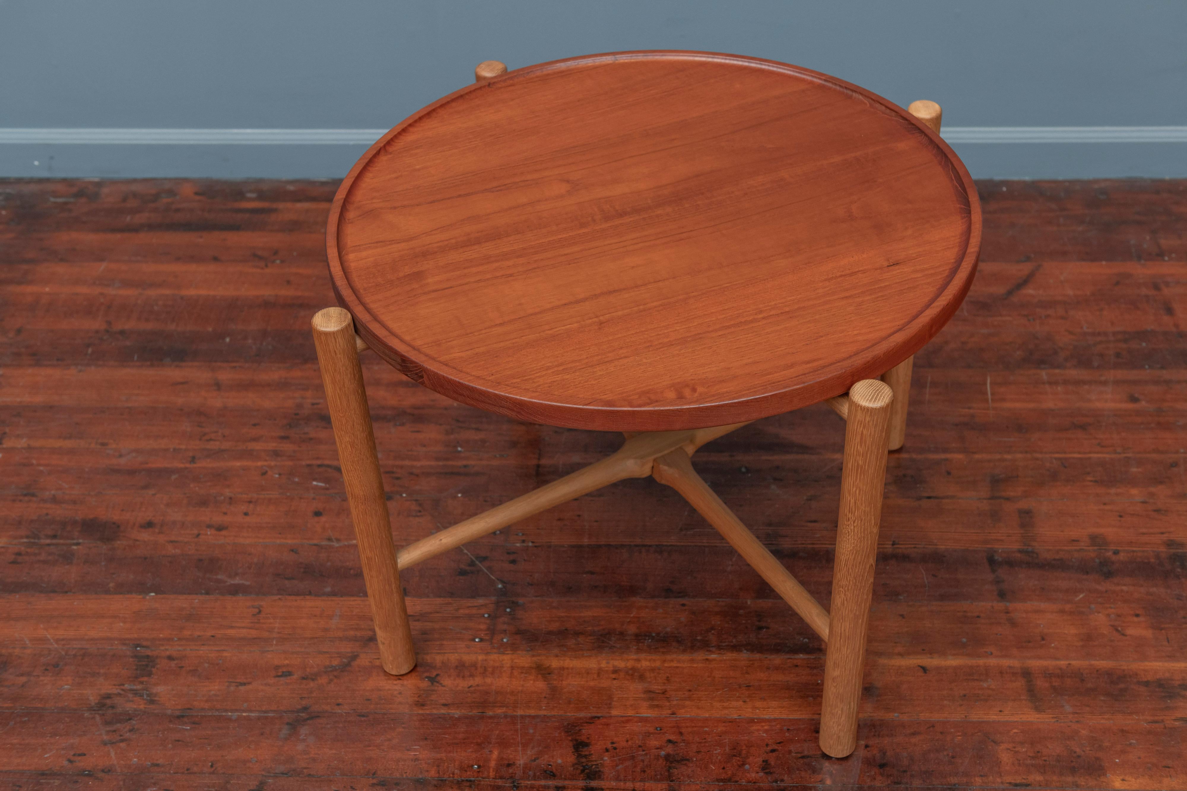 Hans Wegner flip top collapsable coffee or side table designed for Andreas Tuck, Denmark. 
Made from solid teak boards with a sculpted edge on an white oak base, stamped.