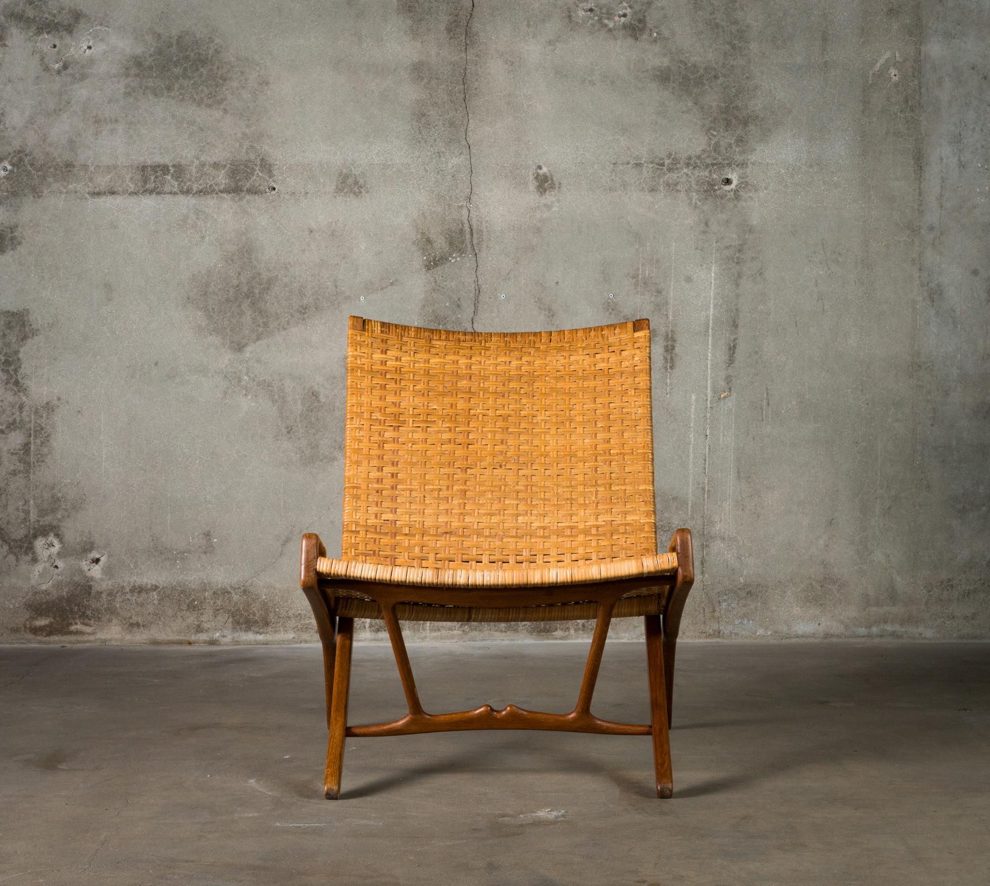 One Hans Wegner folding chair in stained oak and cane, for Johannes Hansen, Denmark 1949.