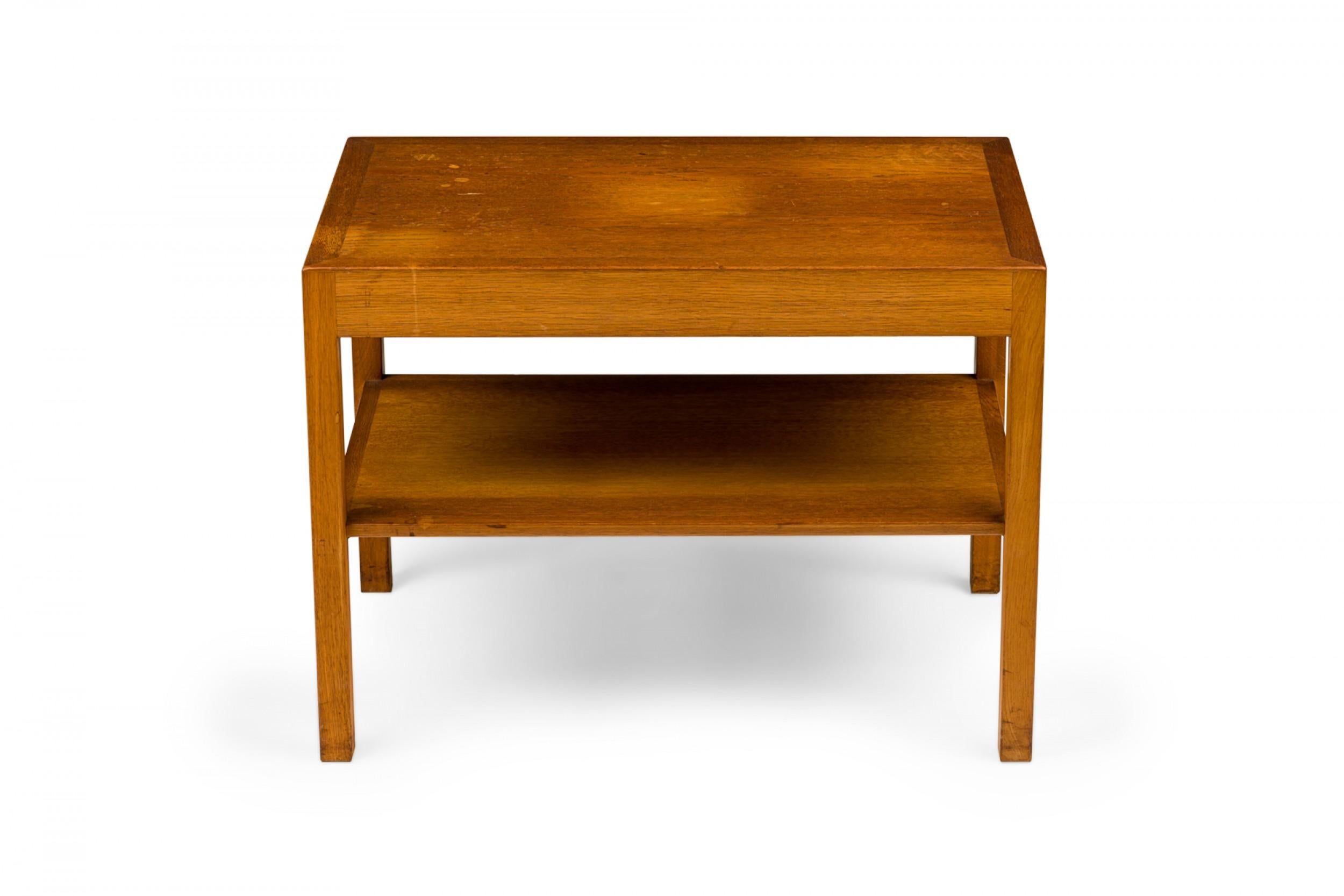 Mid-Century Modern rectangular oak wood end / side table with a lower shelf, resting on four square legs. (HANS WEGNER FOR ANDREAS TUCK)
