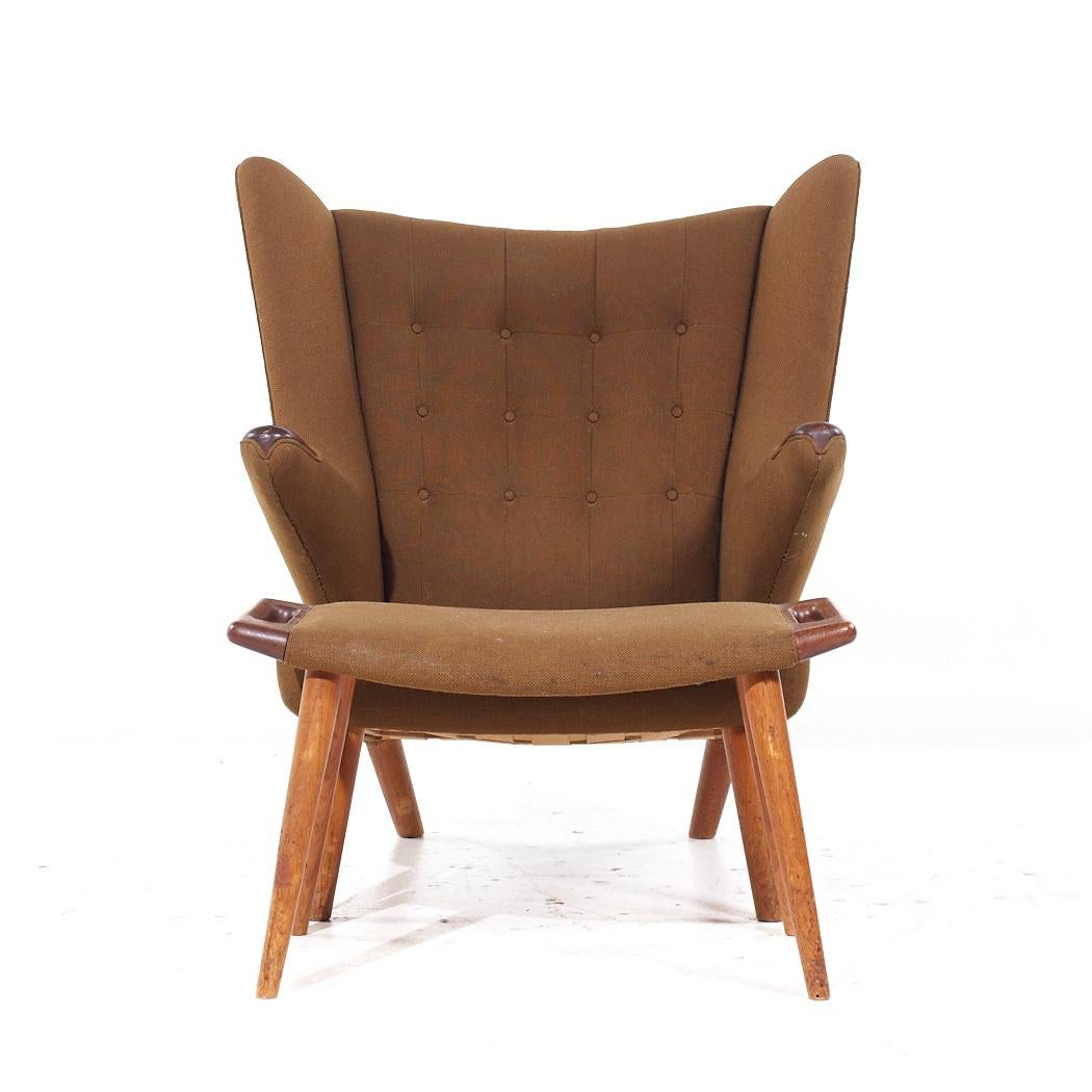 Hans Wegner for AP Stolen AP19 Mid Century Papa Bear Chair and Ottoman

The chair measures: 36 wide x 29 deep x 38.5 high, with a seat height of 14 inches and arm height/chair clearance of 23 inches
The ottoman measures: 27.75 wide x 16 deep x 16