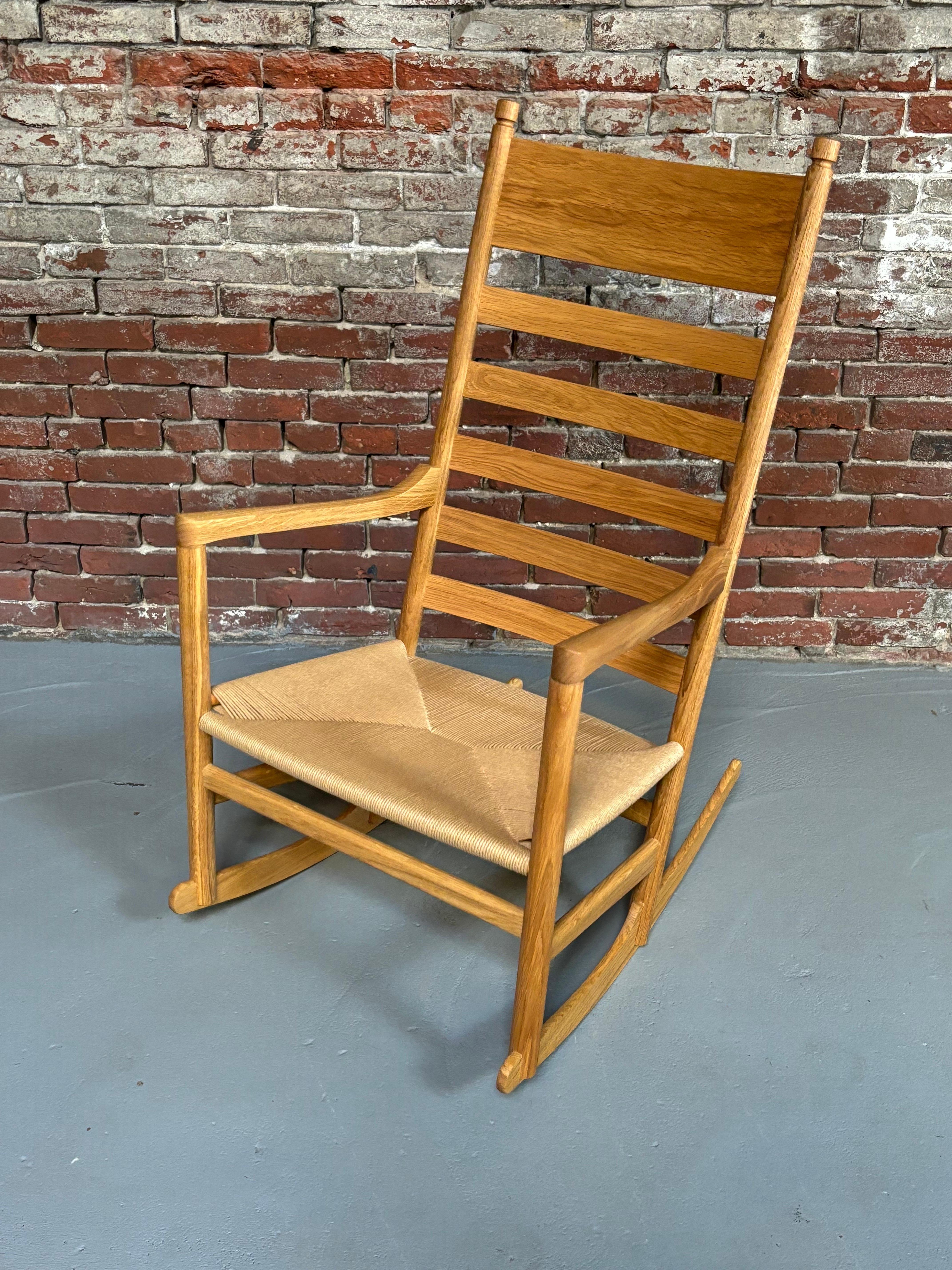 Hans Wegner for Carl Hansen CH45, originally designed in the early 1960's and currently produced.  This is a new unsold model from the Showroom!  Classic Wegner Design complete with hang tags.  Oiled Oak Finish with original new seat and back