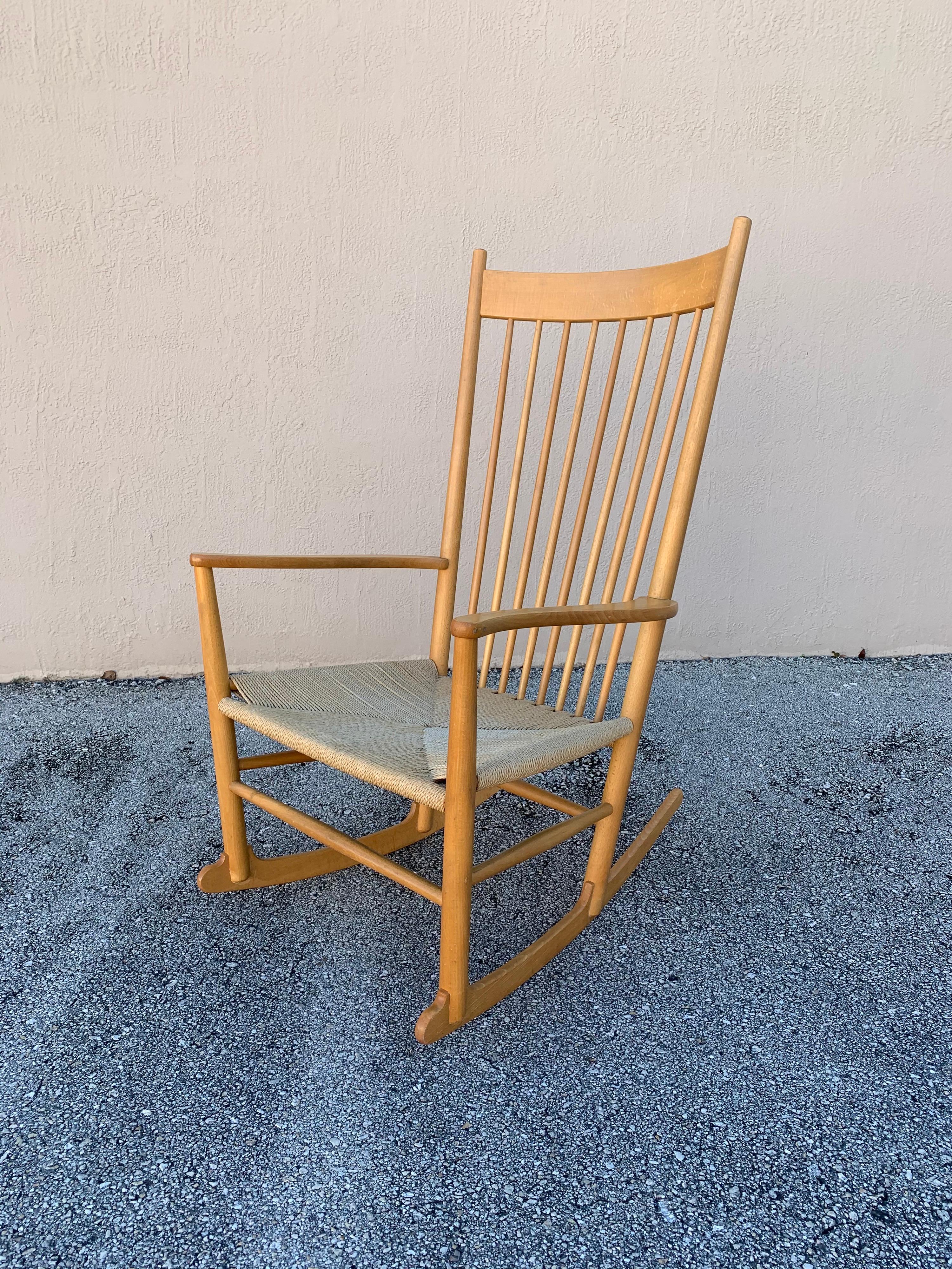 Stunning example of fine Danish design. J16 rocking chair designed by Hans Wegner. In Beech wood and Danish cord. Rocks beautifully. Would fit well in a Mid Century Modern, minimalist, or natural themed styled rooms.