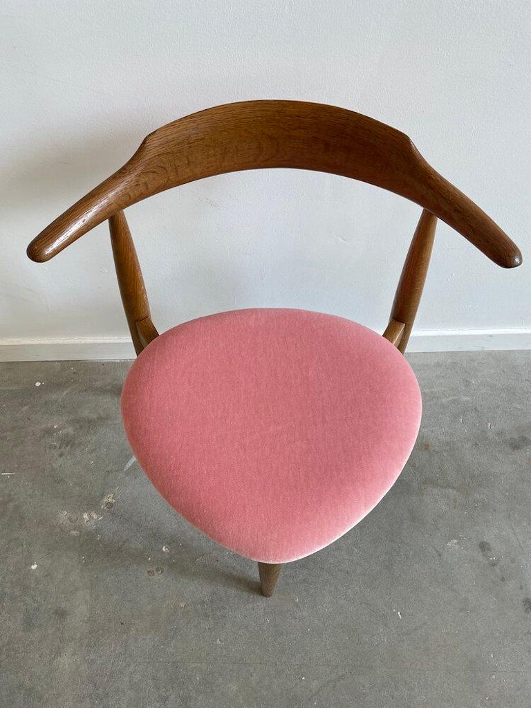 Hans Wegner for Fritz Hansen three legged heart chair in pink Mohair.
