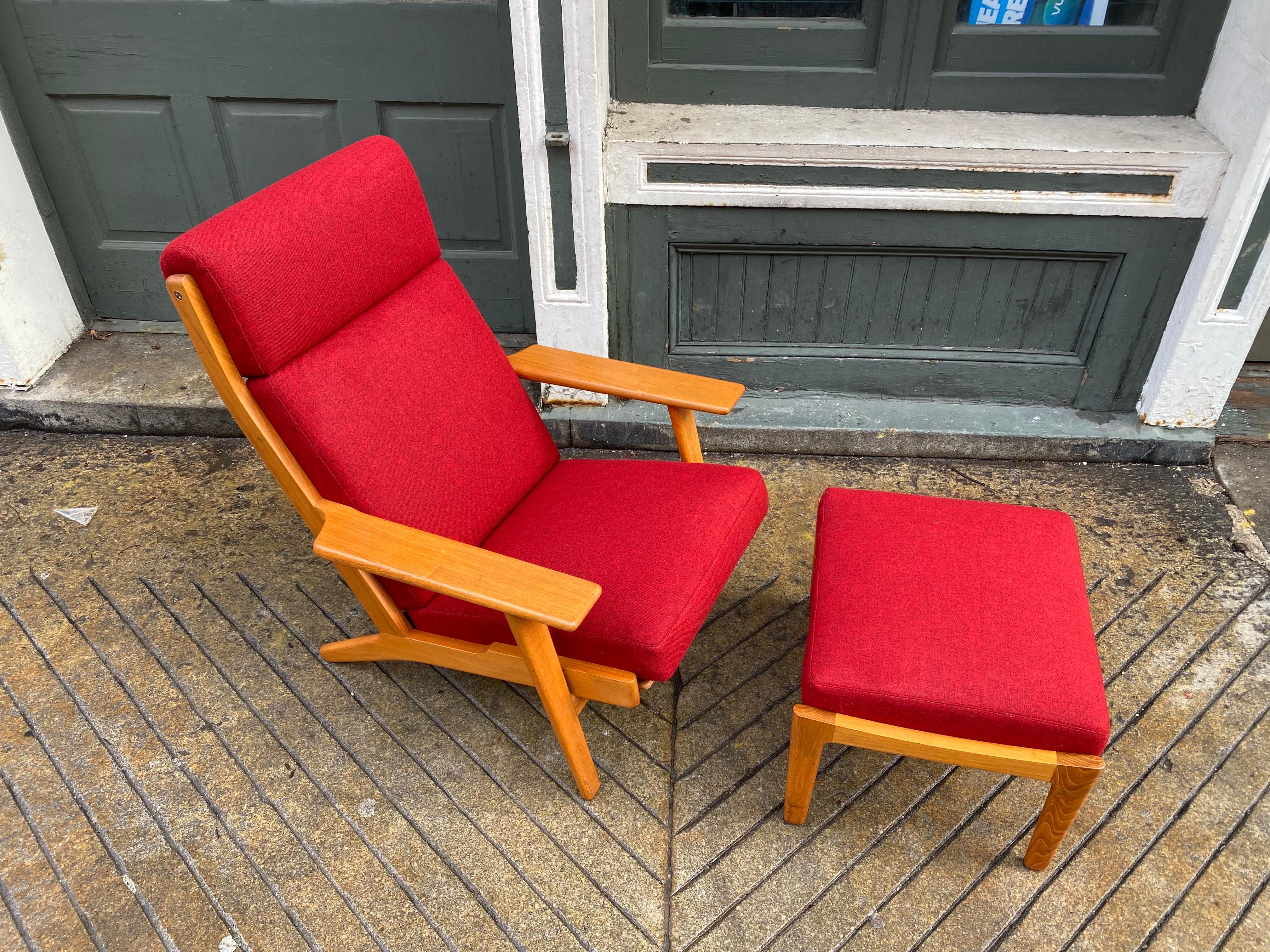 Hans Wegner for Getama High Back Oak Lounge Chair and Ottoman. Beautiful Wood in Original Condition. Upholstery is newly done in a Knoll Fabric. All original wire coil springs rewrapped and filled! Nice to have with Ottoman! Check out my other Hans