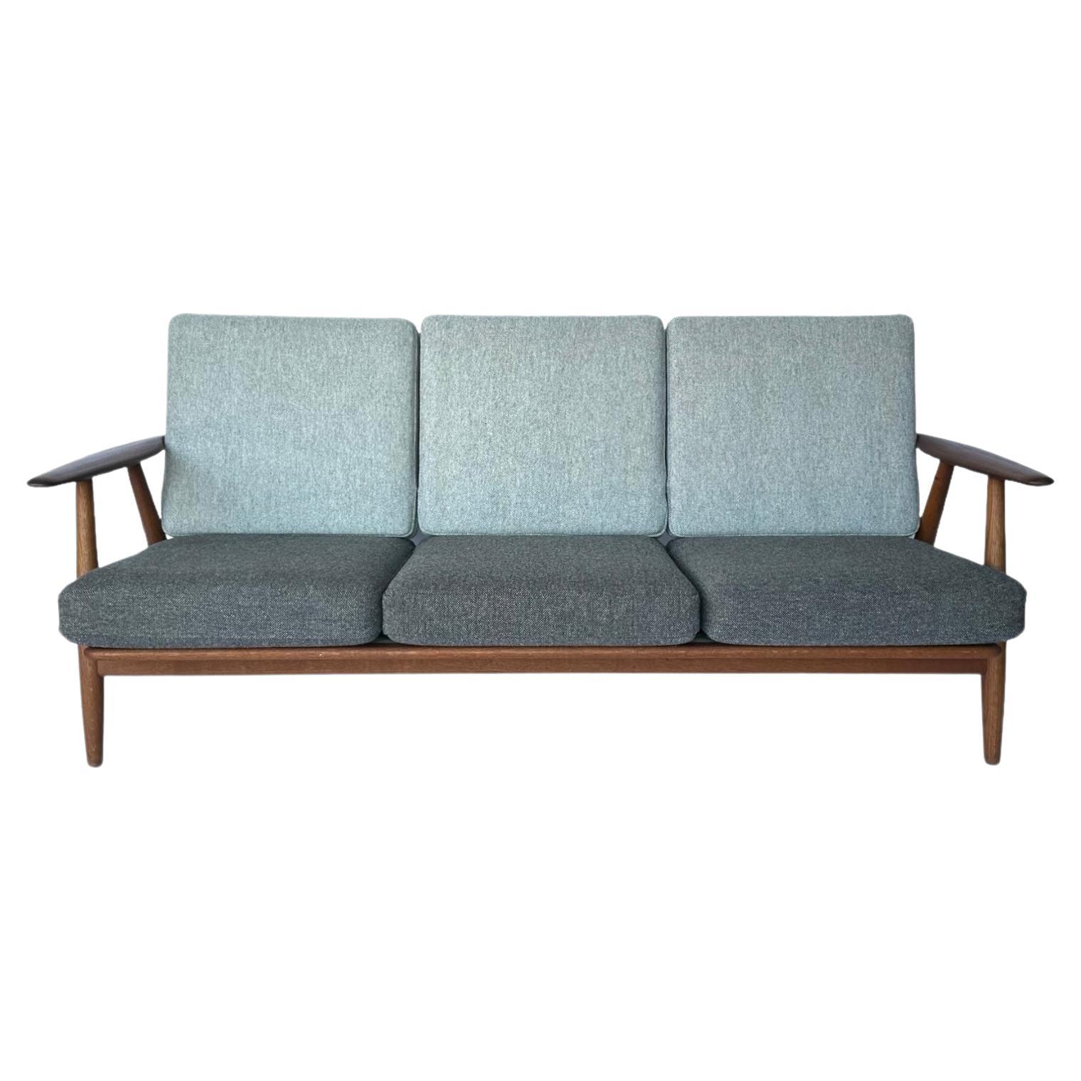 Hans J. Wegner for Getama Signed Sofa with new Mataram Upholstery For Sale