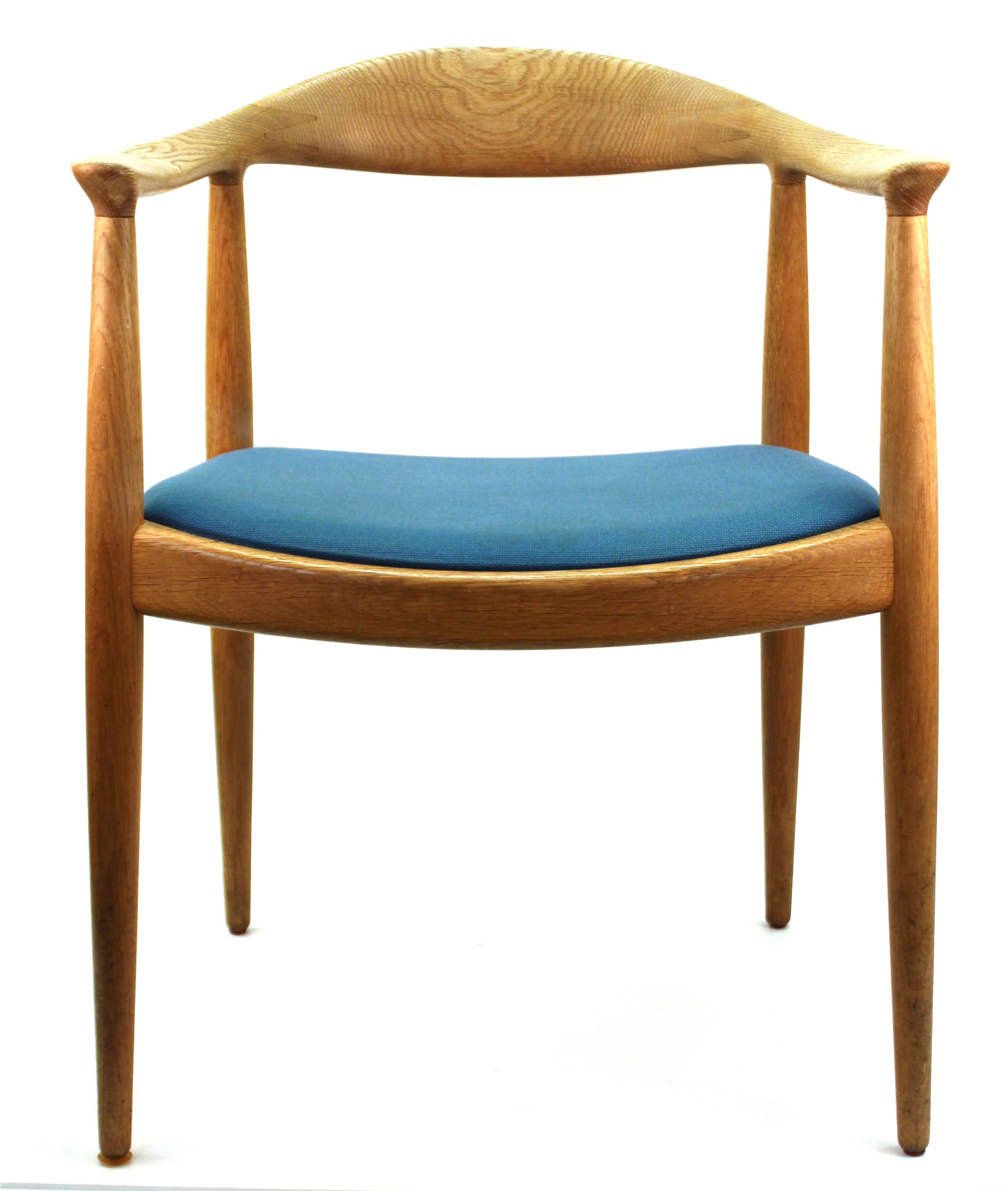 Danish Modern pair of iconic model JH 501 chairs designed by Hans Wegner for Johannes Hansen in the 1950s. The pair is upholstered in light blue fabric and has branded makers marks on the underside of the seating structure. The pair is in great