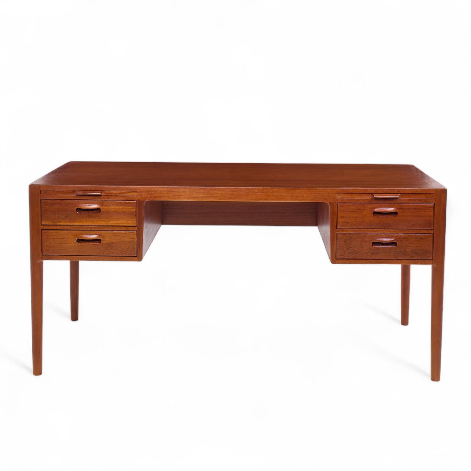 Hans Wegner for Johannes Hansen Model 573 Mid Century Danish Teak Desk

This desk measures: 61.25 wide x 31.5 deep x 28.75 high, with a chair clearance of 26.5 inches

All pieces of furniture can be had in what we call restored vintage condition.