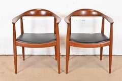 Hans Wegner for Johannes Hansen "The Chair" Teak and Leather Round Chairs, Pair